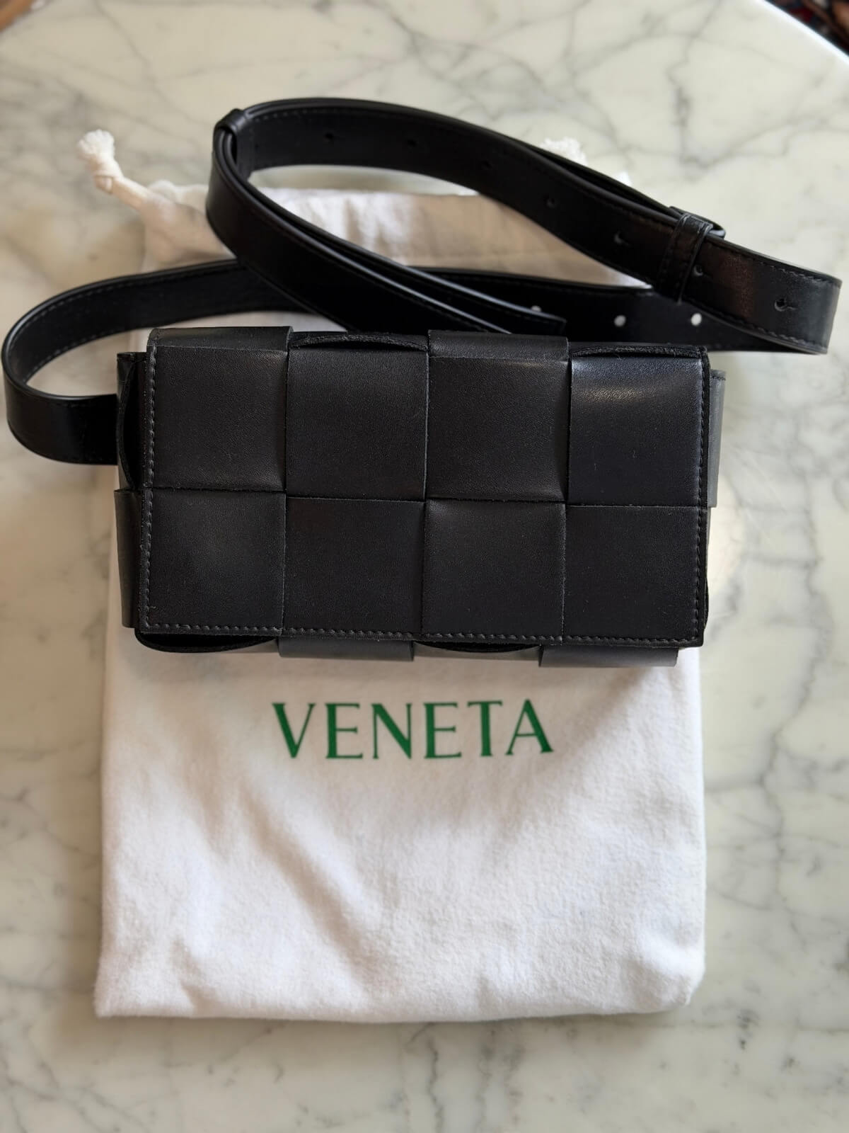 Louise Row featuring Bottega Cassette bag on table