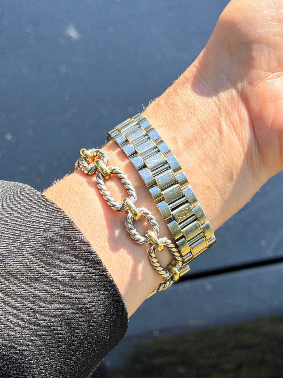 Louise Row featuring Model wearing Cartier must watch in stainless silver and gold round dial.