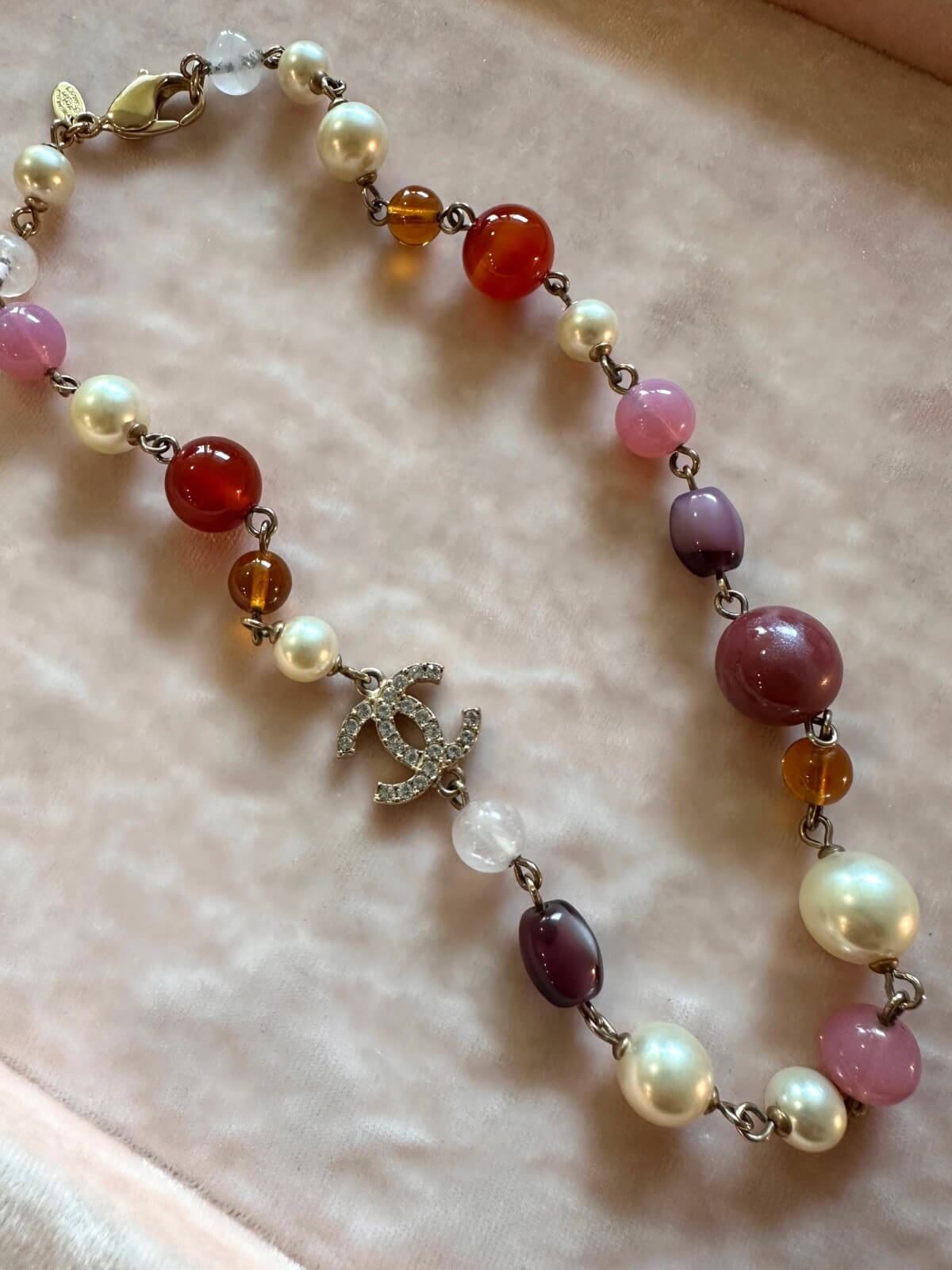 Louise Row featuring Chanel beaded necklace on pink pad