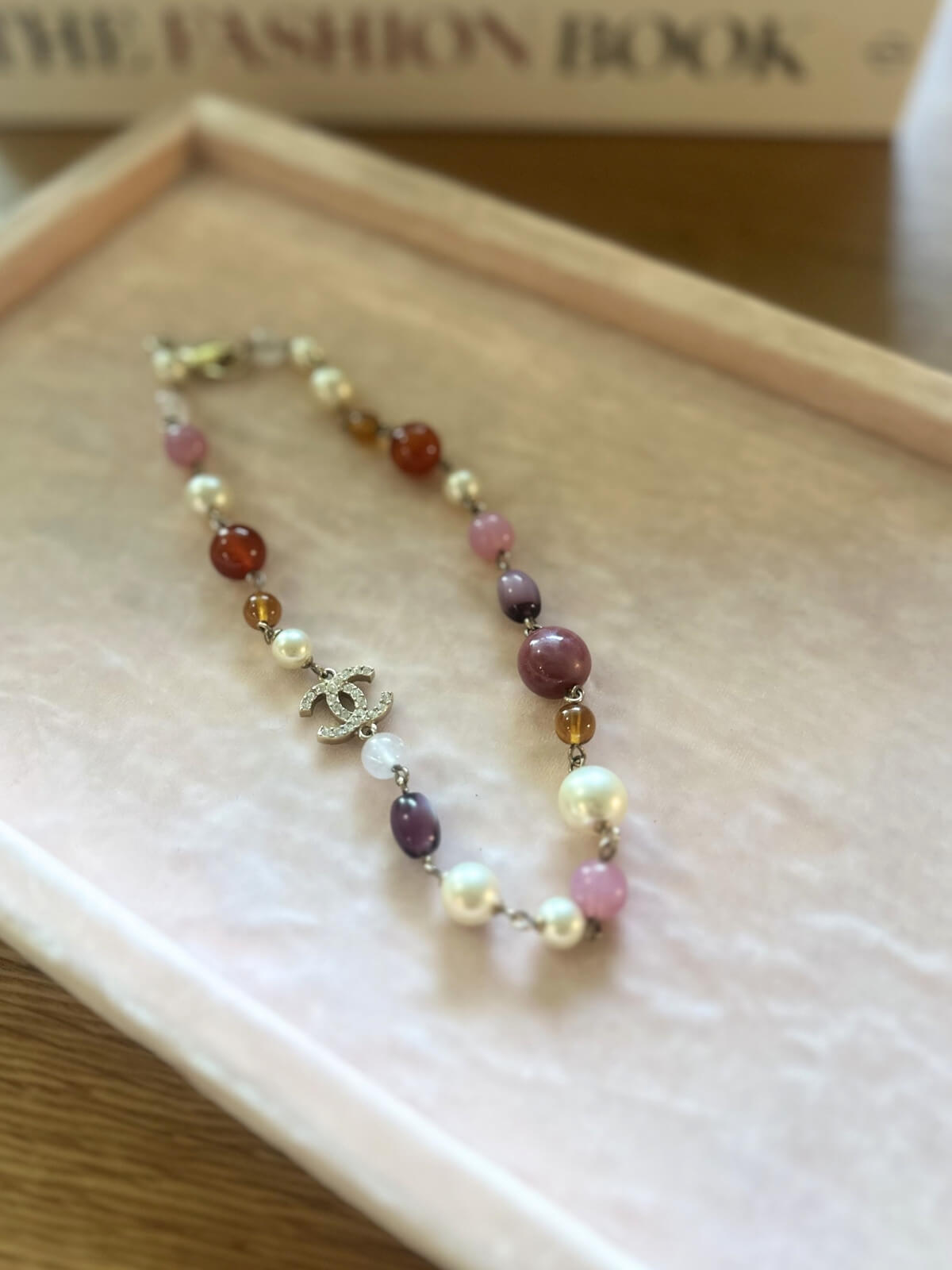 Louise Row featuring Chanel beaded necklace on pink pad