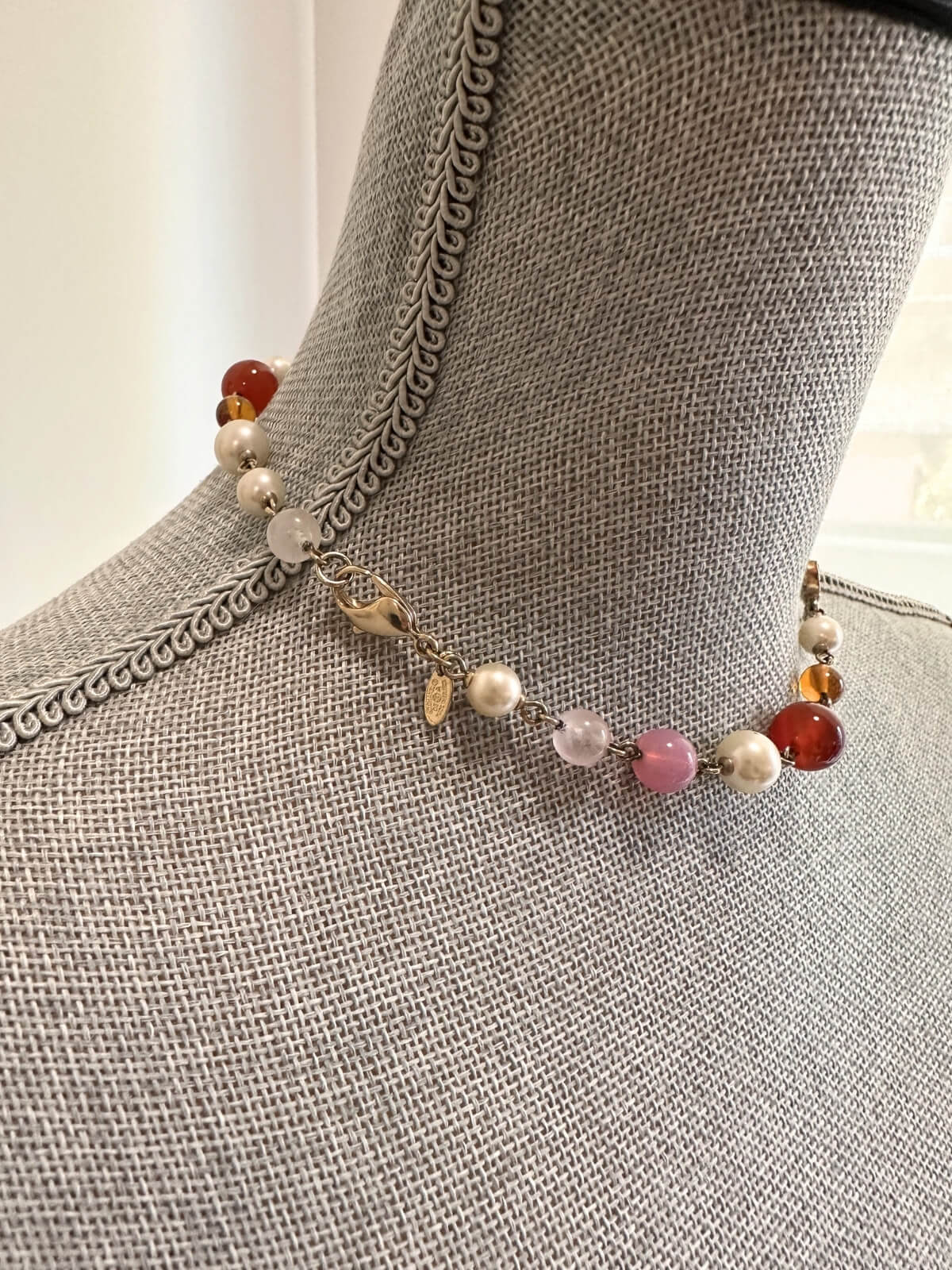 Louise Row featuring Chanel beaded necklace on grey mannequin