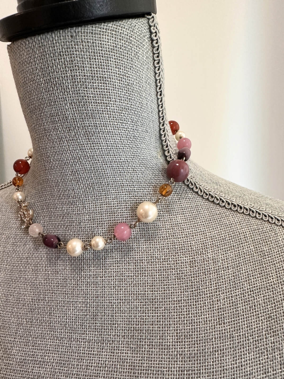 Louise Row featuring Chanel beaded necklace on pink pad