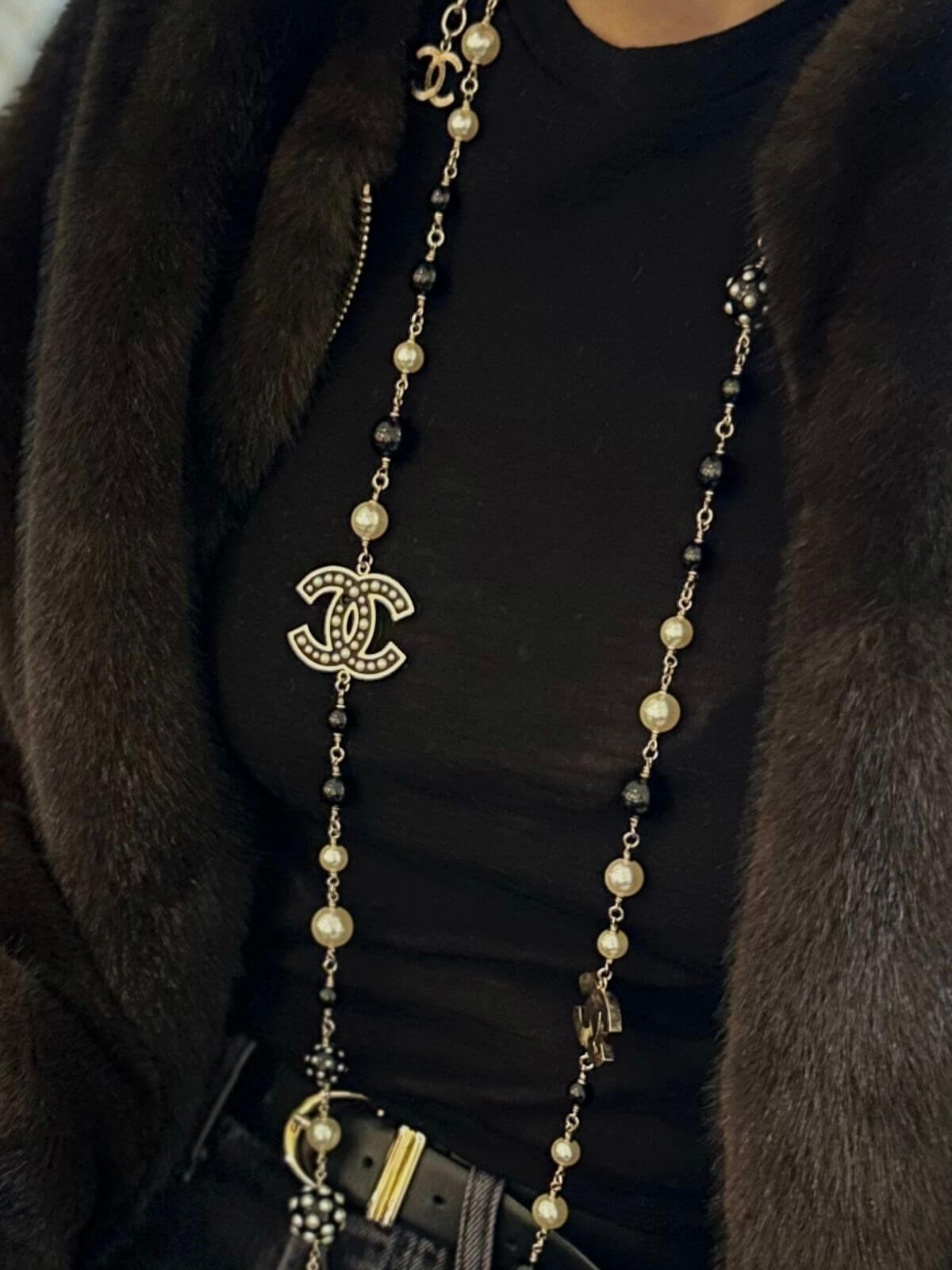 Model in Chanel Pearl and Onyx necklace