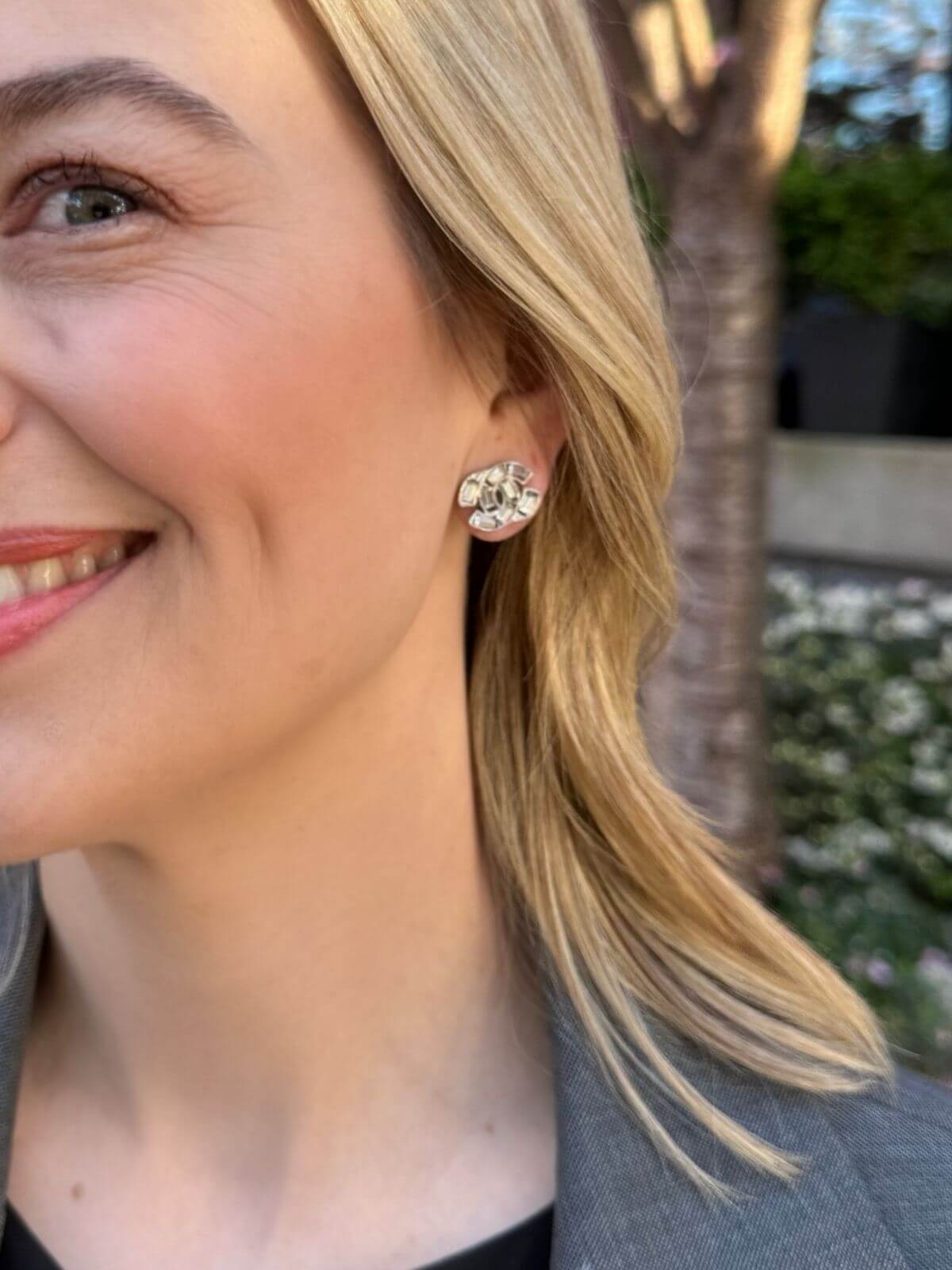 Louise Row Studio crystal Chanel earrings with a CC design on model with blonde hair