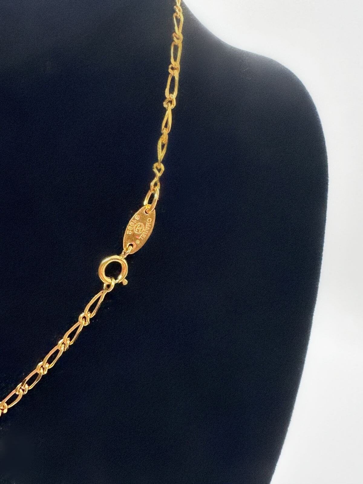 Signature detail of Chanel necklace