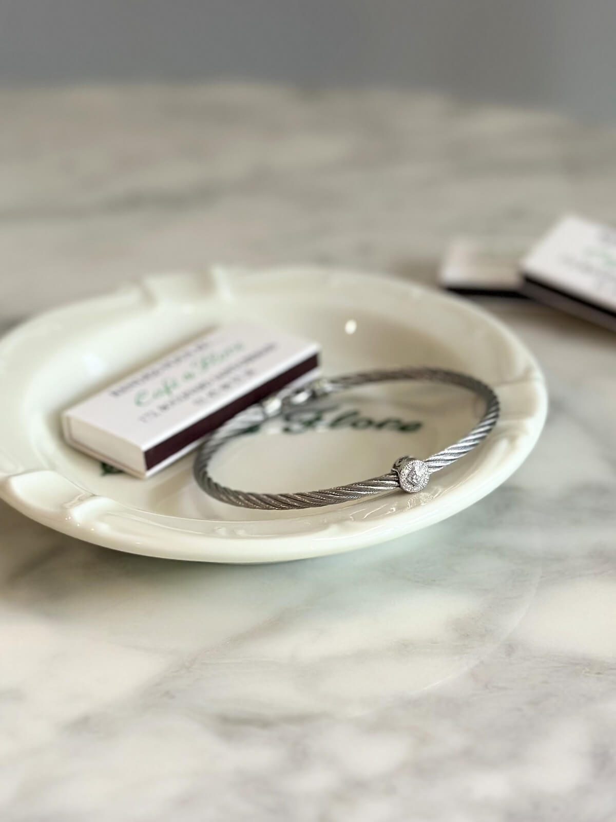 Louise Row Studio featuring Charriol Silver Bracelet with diamond station on plate