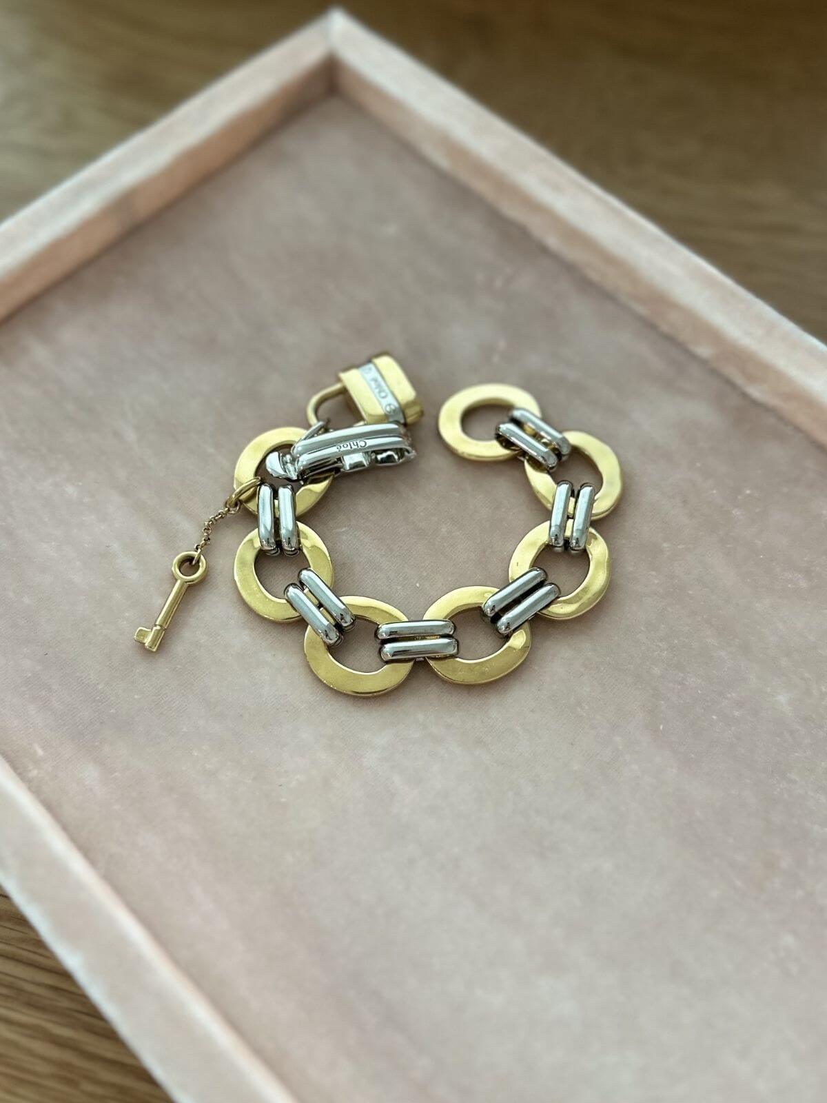 Chloe bracelet on pink display with lock charms