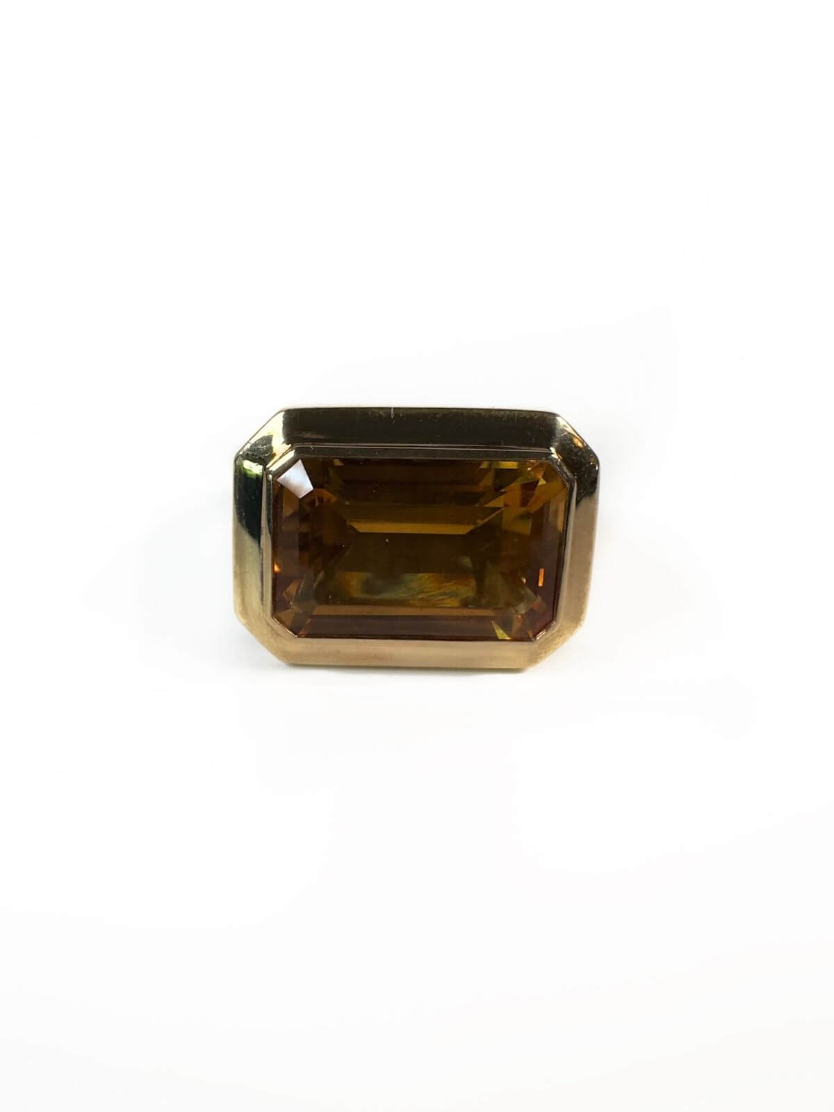 DY Gold ring with a large rectangular citrine gemstone on a white only stone shown