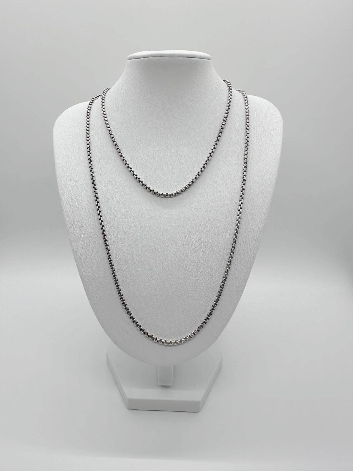 David Yurman box chain Silver chain necklace on a white mannequin bust against a white background