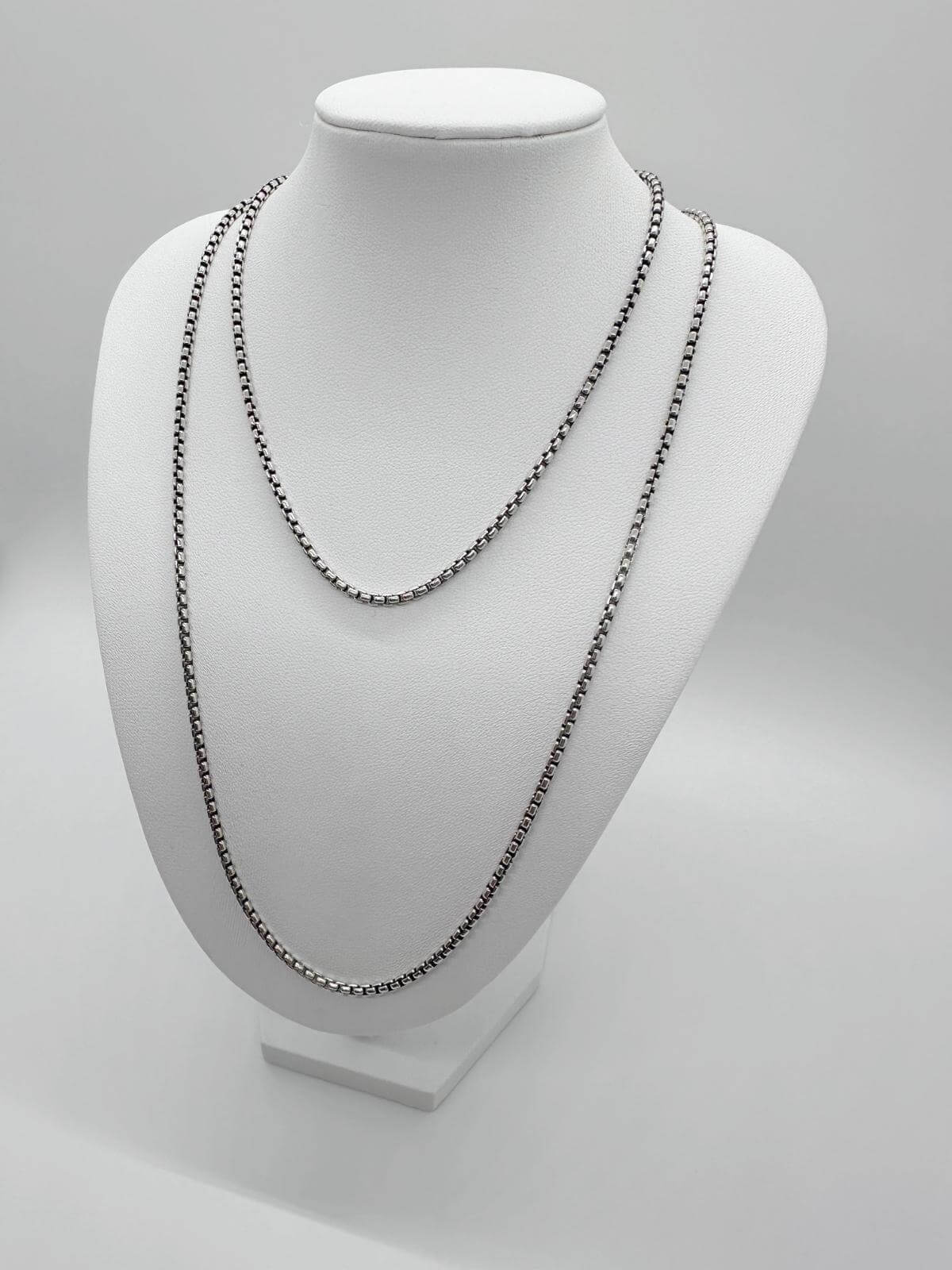 David Yurman box chain Necklace on a mannequin bust against a gray background
