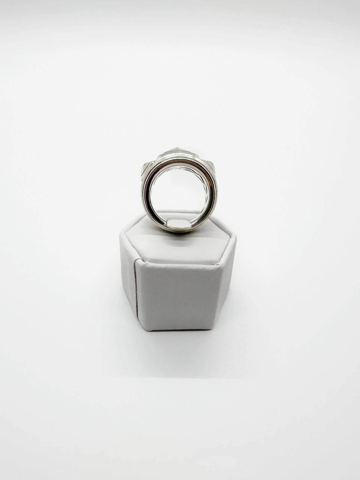 back of DY Silver Renaissance ring on white fixture on white background
