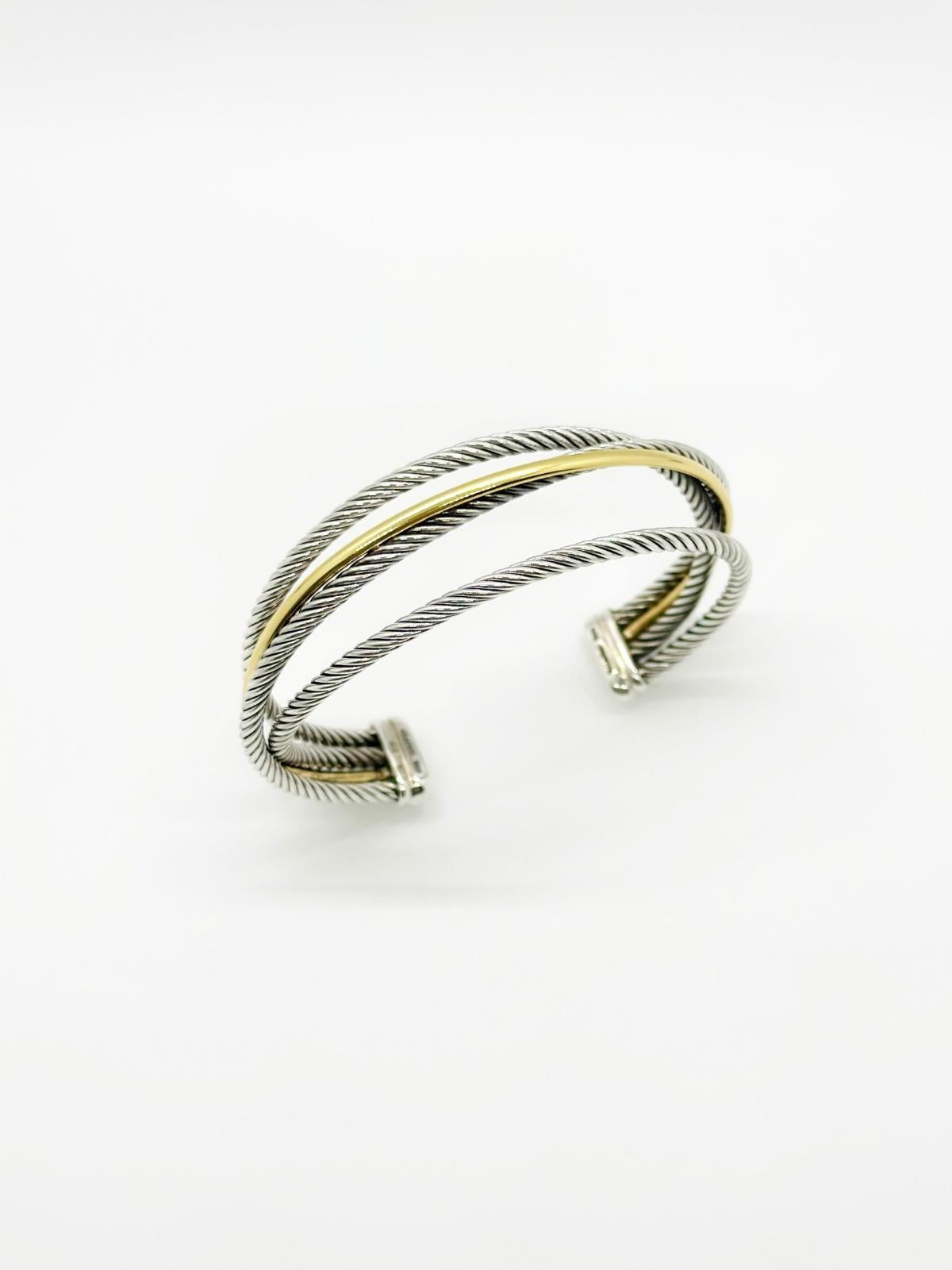 David Yurman Crossover cuff in gold and silver on white background