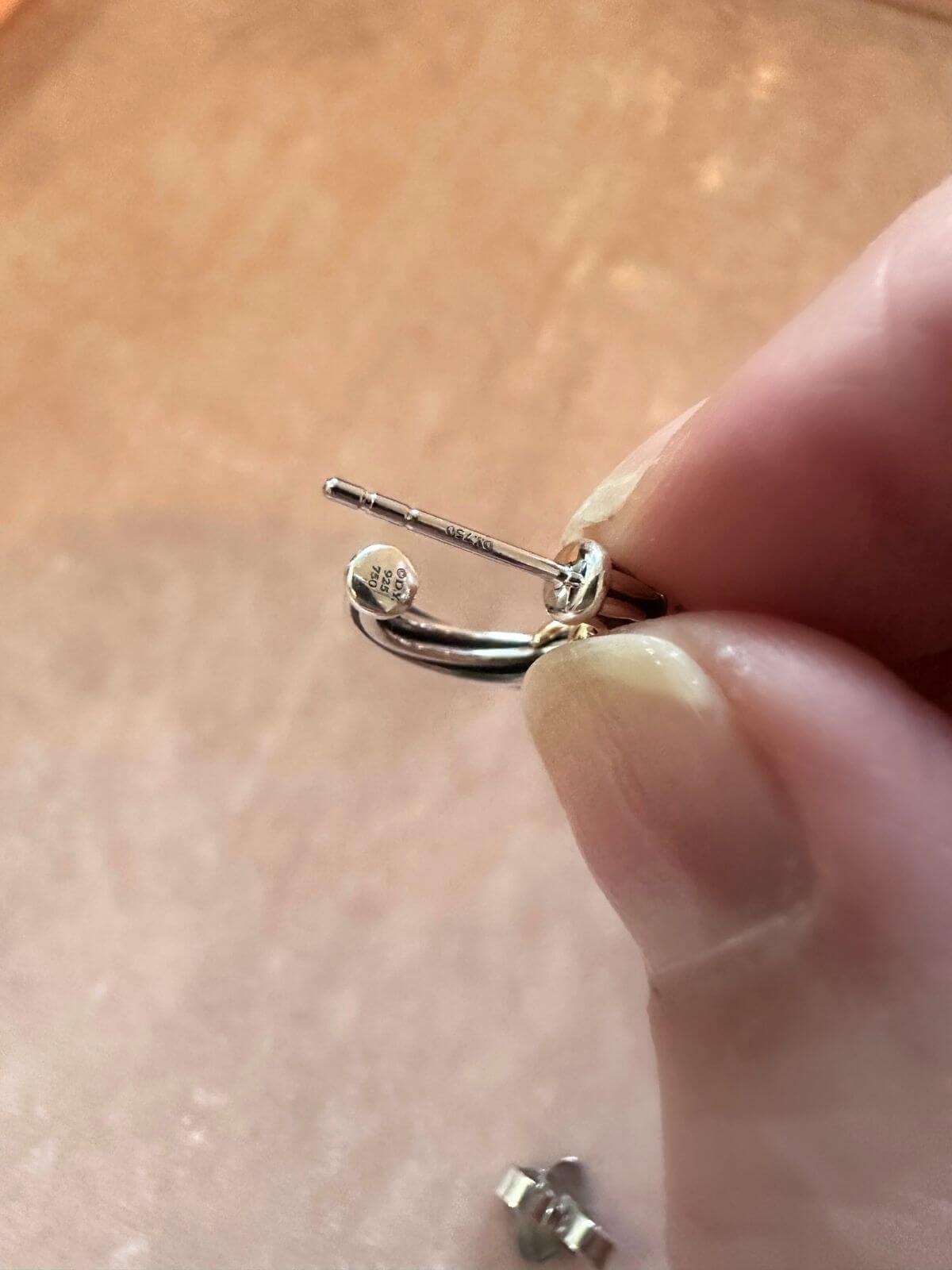 David Yurman Helena silver and gold small hoops held to show signature