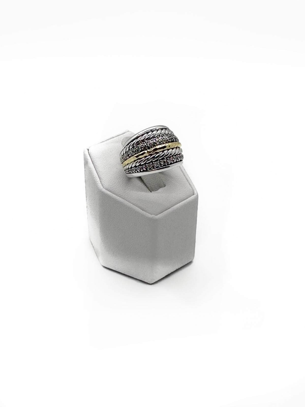 David Yurman silver and diamond ring on grey fixture on white background.