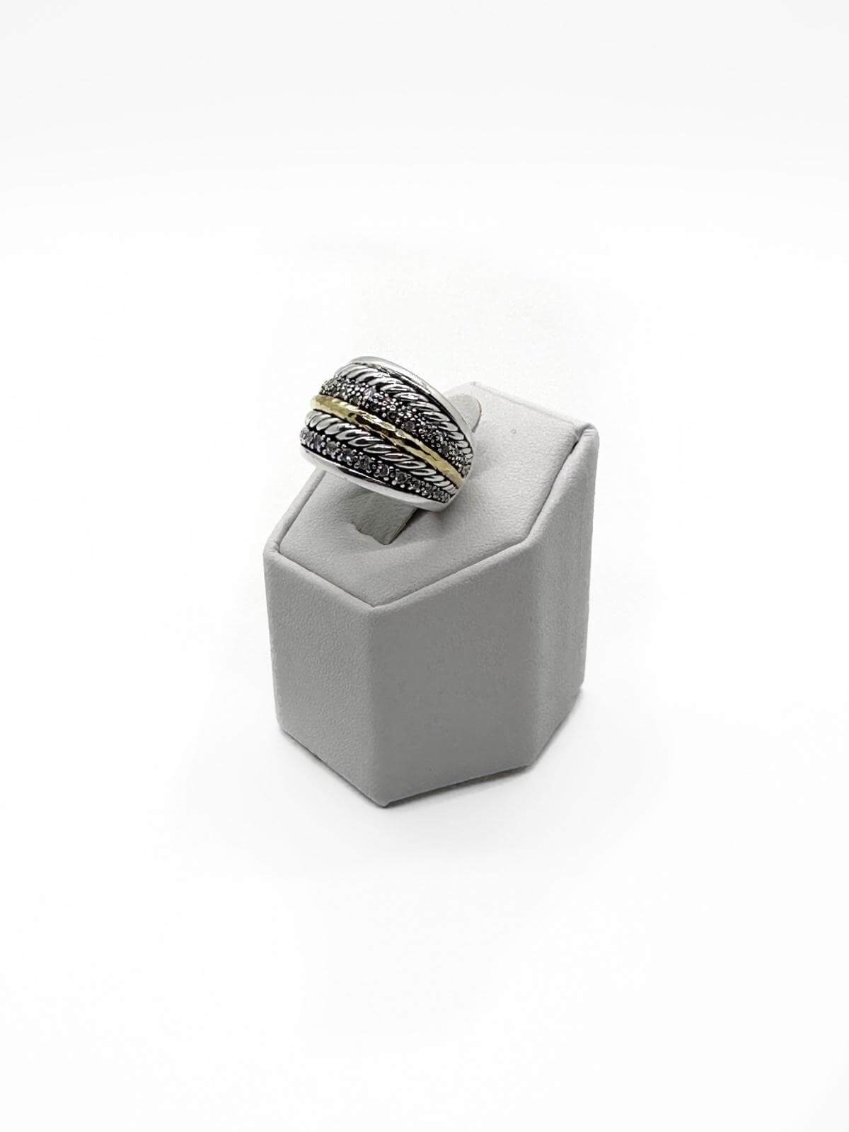 David Yurman silver and diamond ring on grey fixture on white background.