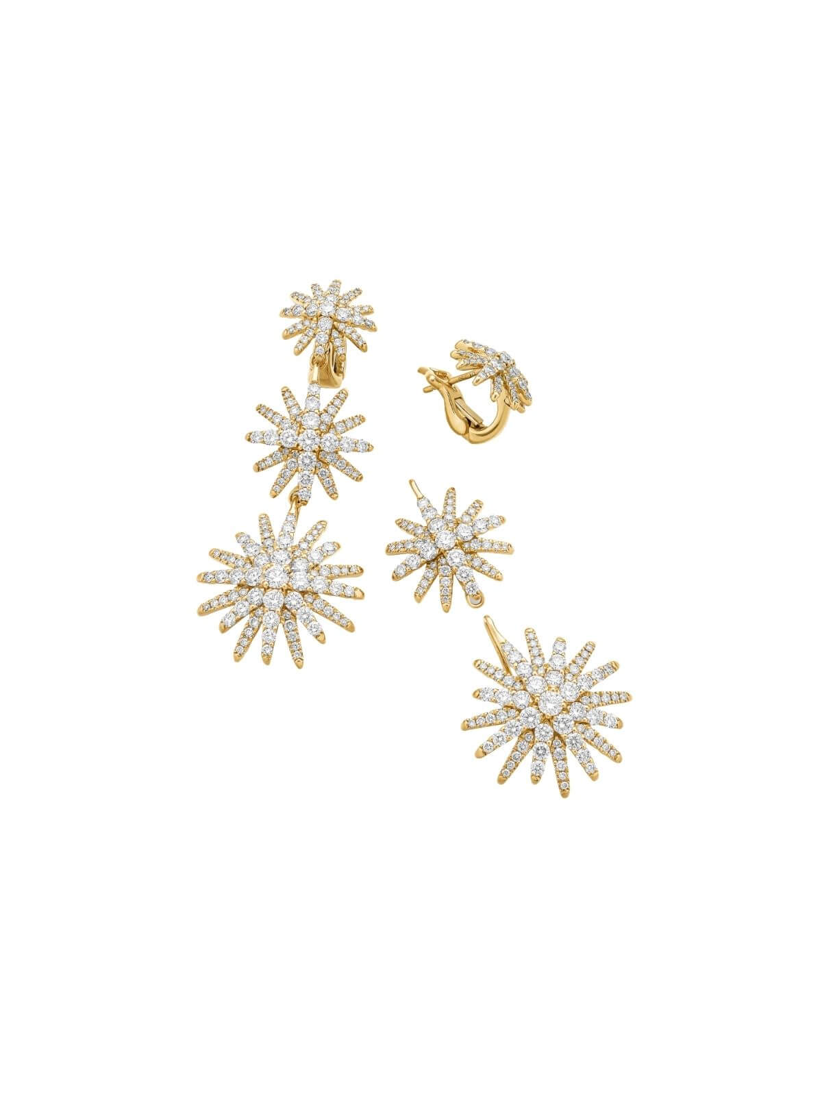 Gold and diamond earrings on a white background