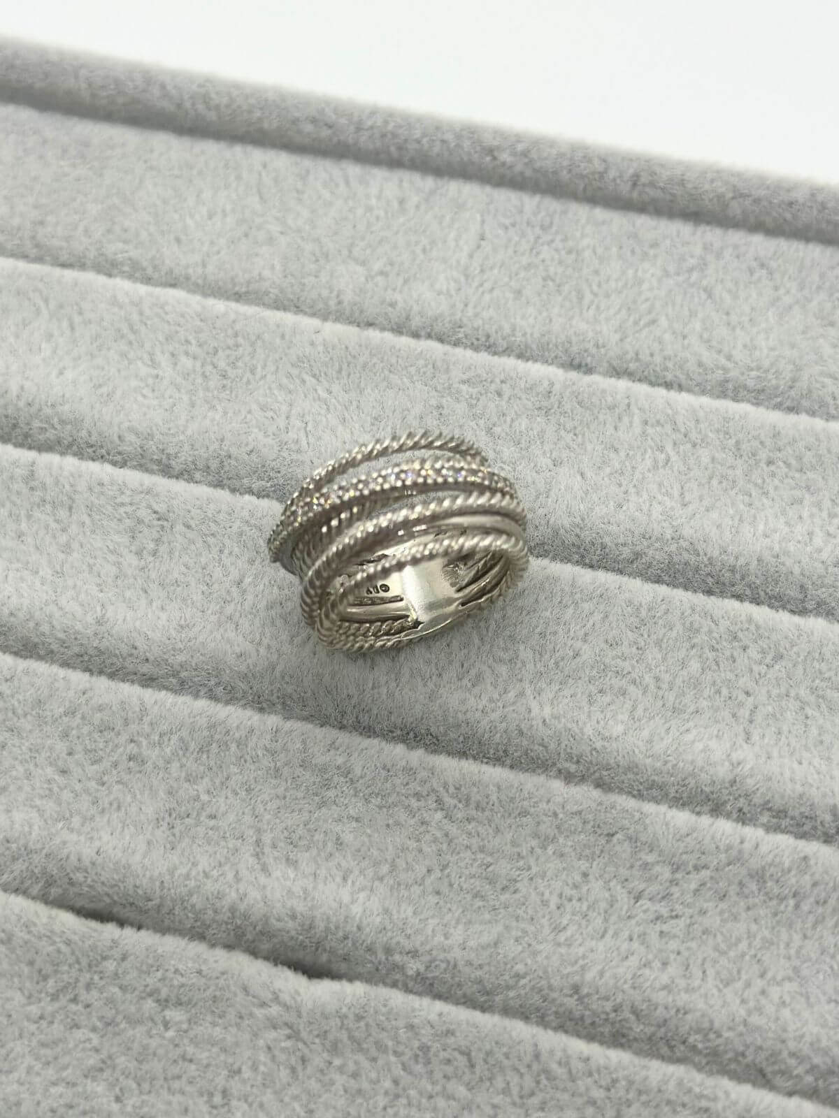 Silver David Yurman Crossover Ring with dia on grey background