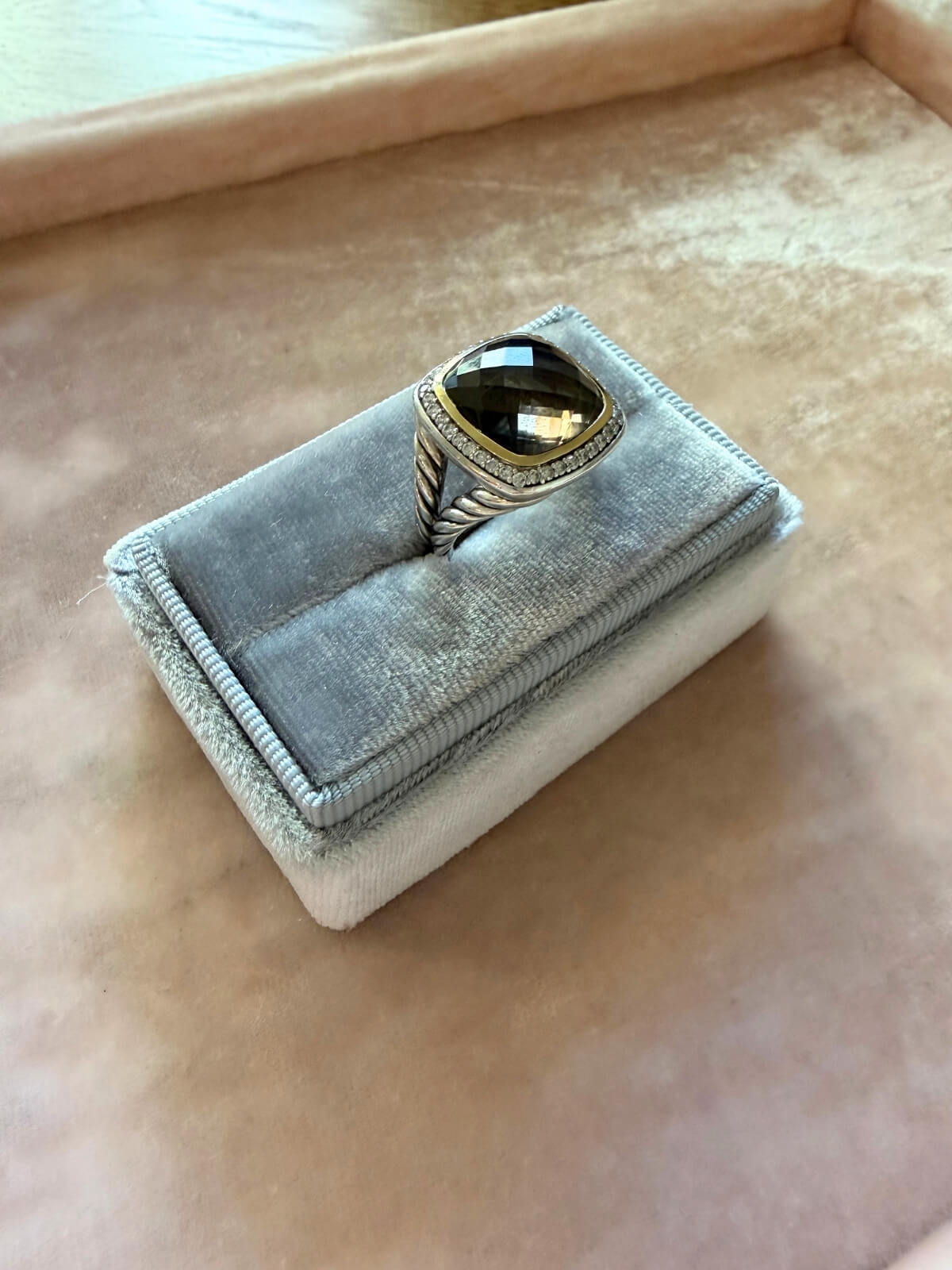 Louise Row Studio featuring David Yurman Albion ring, smokey quartz center stone with gold and silver metal on grey fixture.