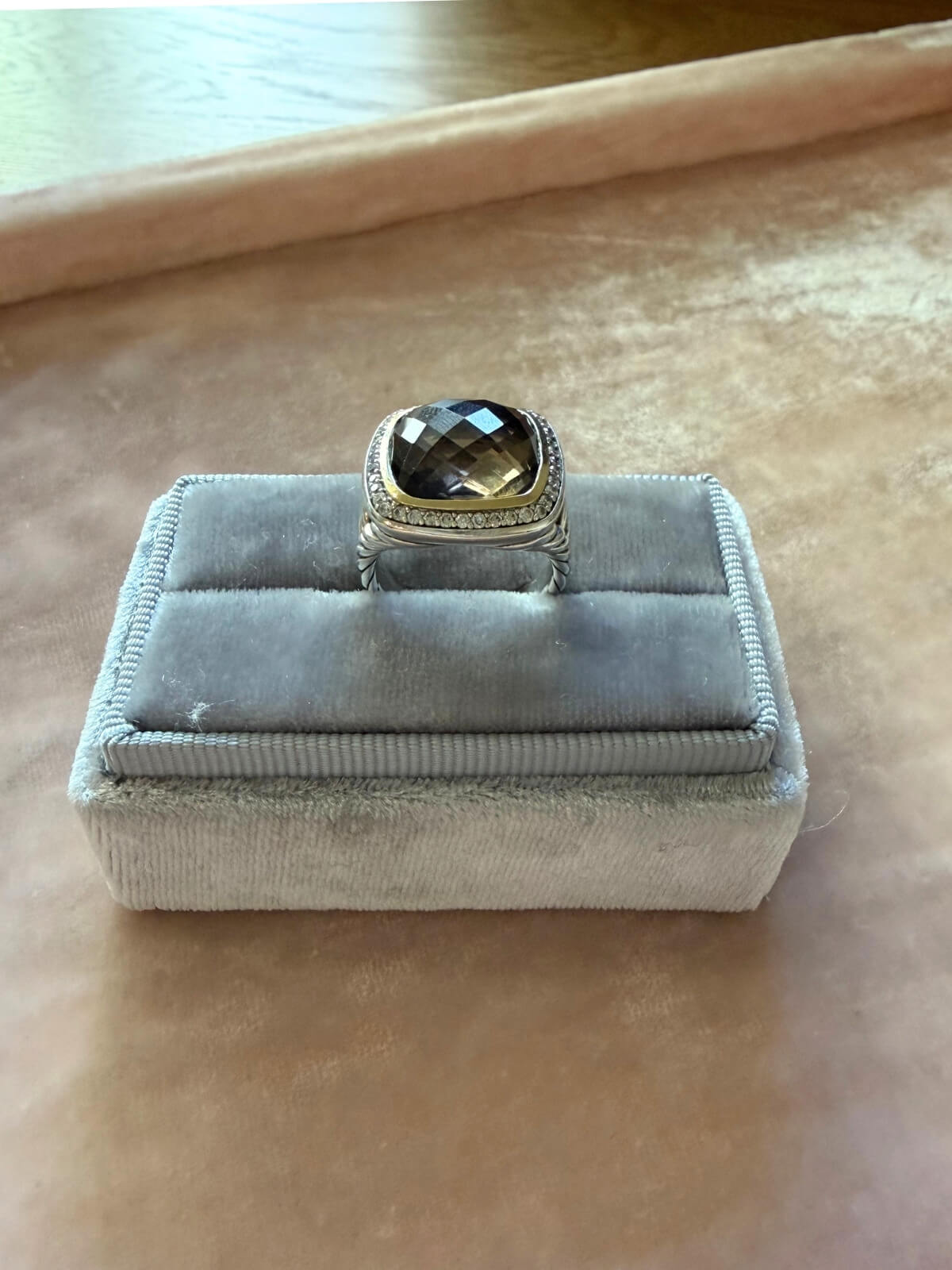 Louise Row Studio featuring David Yurman Albion ring, smokey quartz center stone with gold and silver metal on grey fixture.