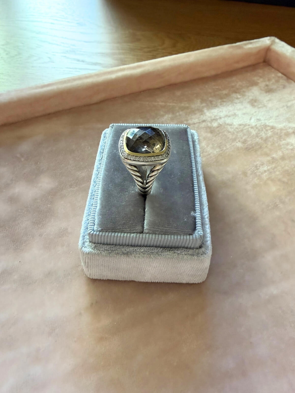 Louise Row Studio featuring David Yurman Albion ring, smokey quartz center stone with gold and silver metal on grey fixture.