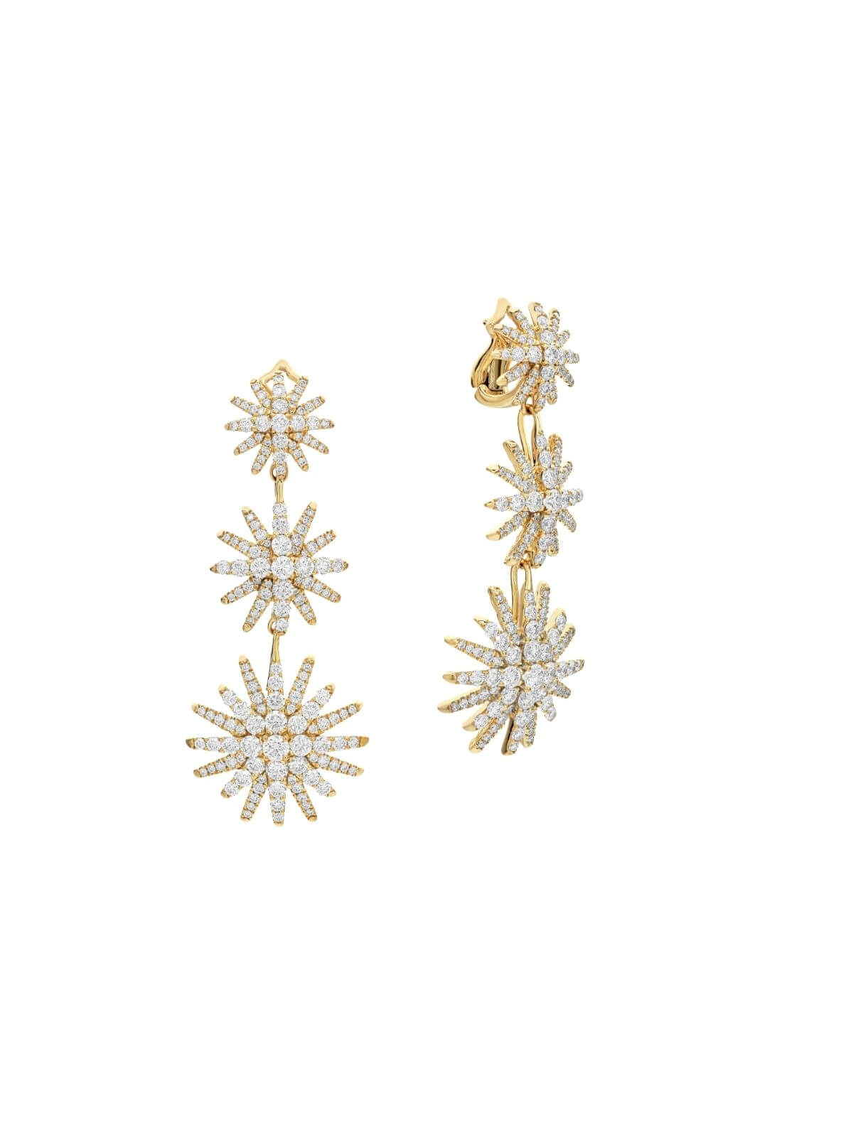 Gold and crystal star-shaped earrings on a white background