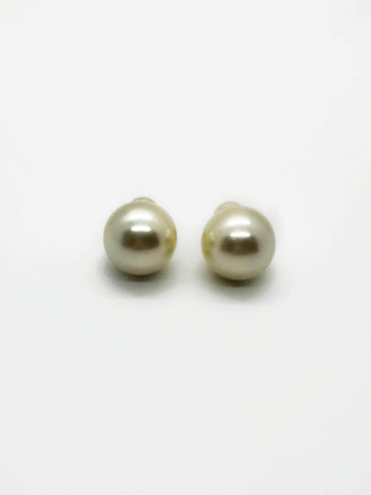 Pair of pearl earrings on a white background