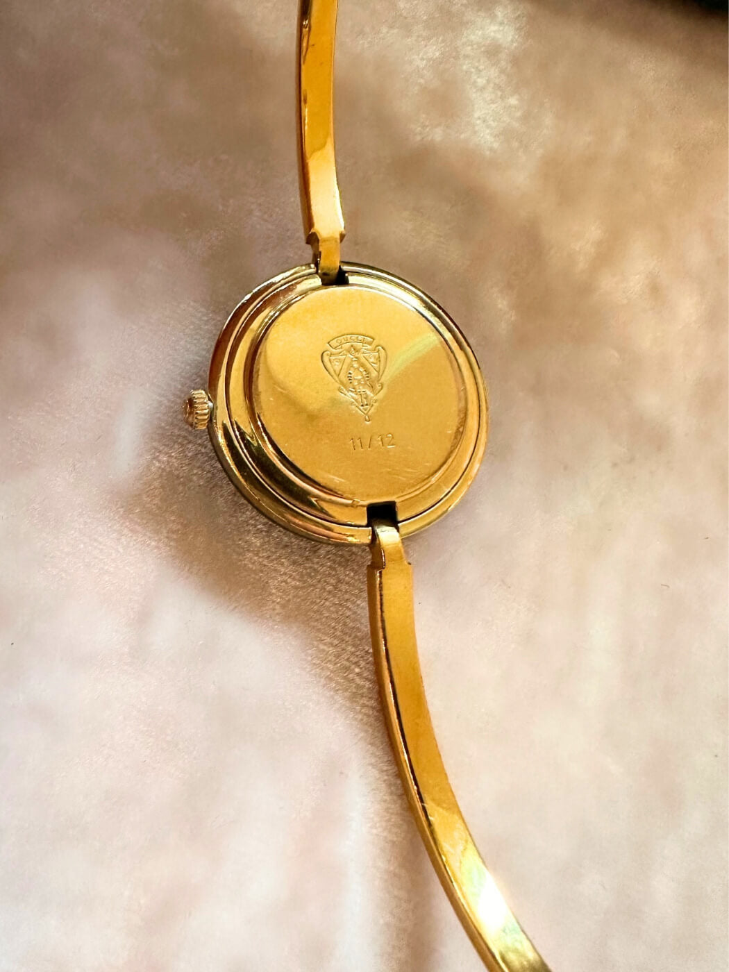 Louise Row featuring vintage Gucci 1100 watch in original box showing back of dial