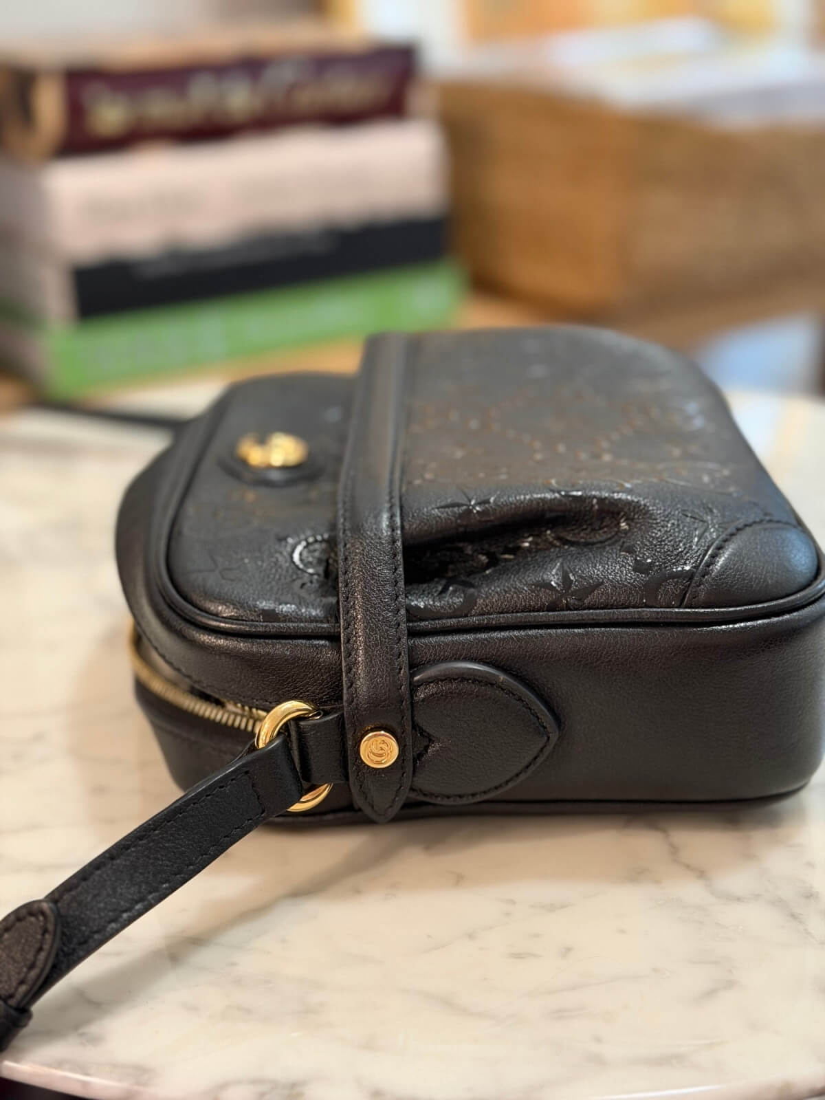 Louise Row featuring Gucci Star Monogram bag on table 