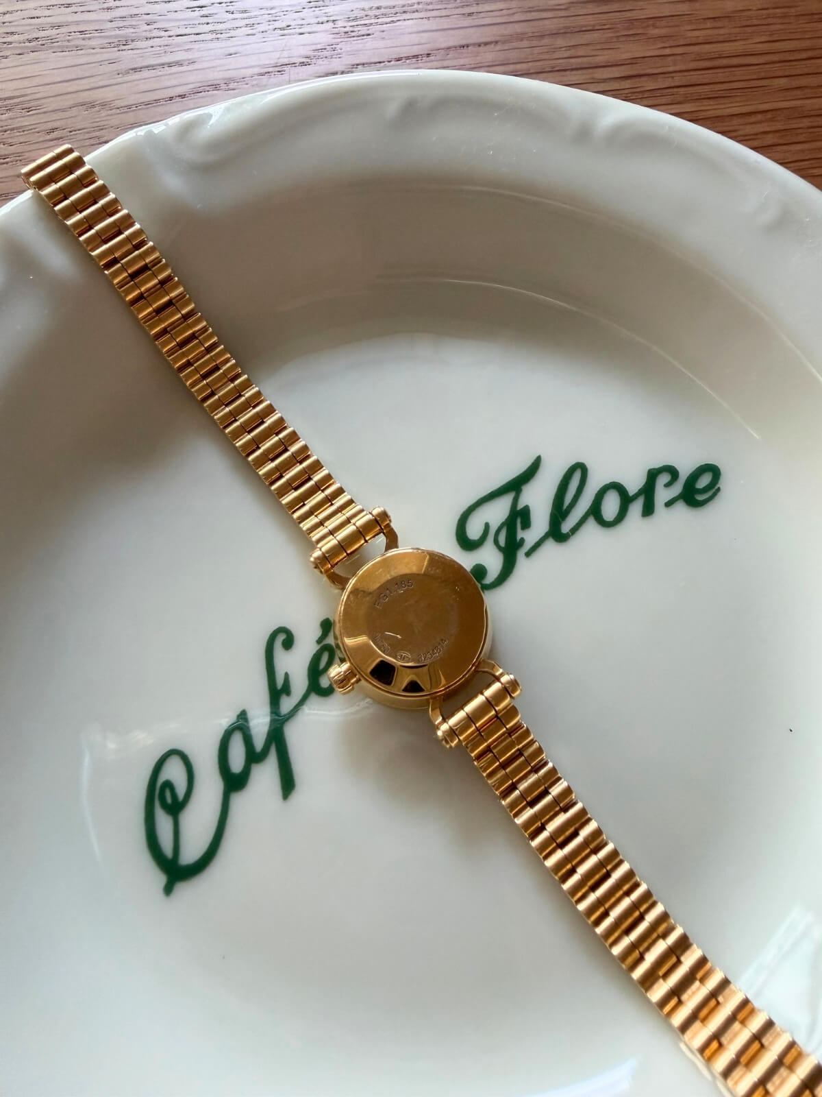 Louise Row featuring Hermes 18K yellow gold Faubourg watch on plate