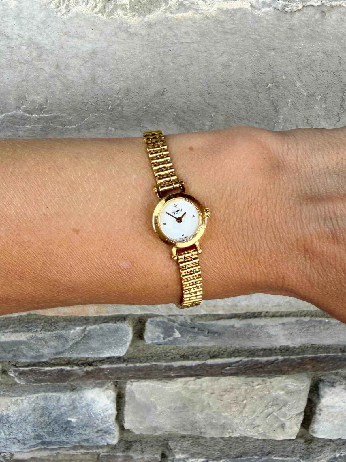 Louise Row featuring Hermes Faubourg watch on wrist 