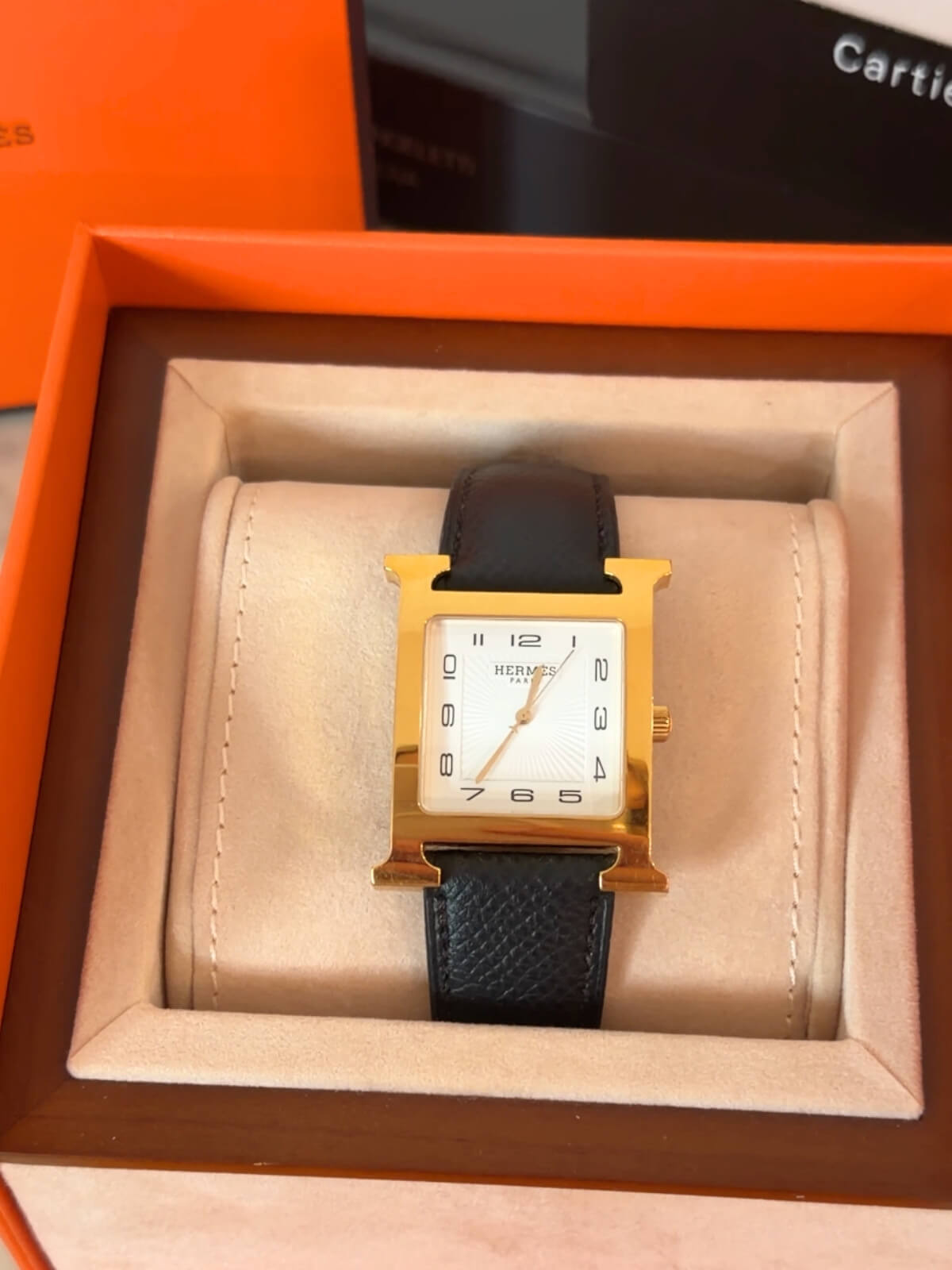 Louise Row featuring Hermes Heure H Watch gold H and on box and black leather strap 