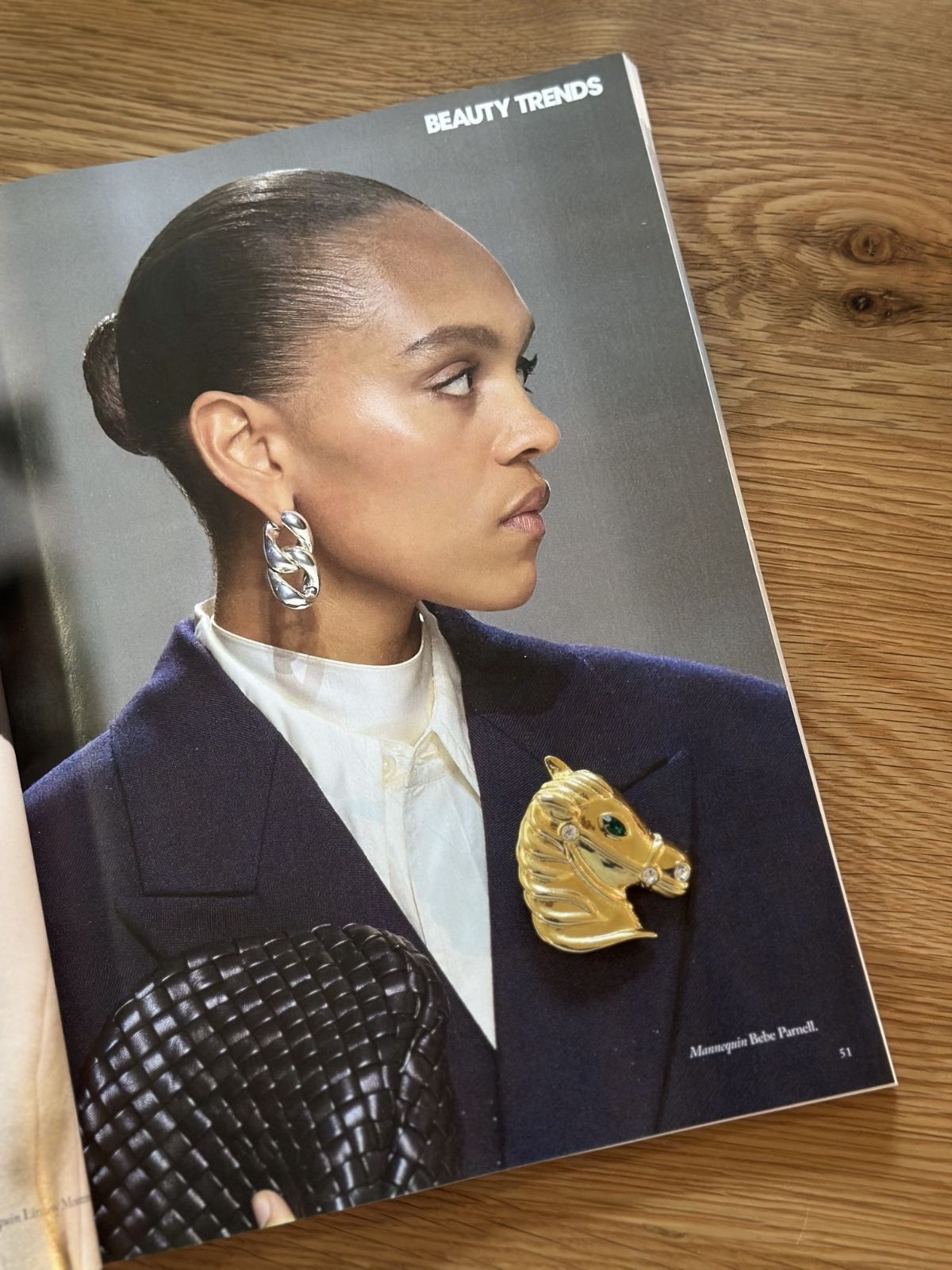 Louise Row Studio Vintage gold Horse Brooch on magazine with woman