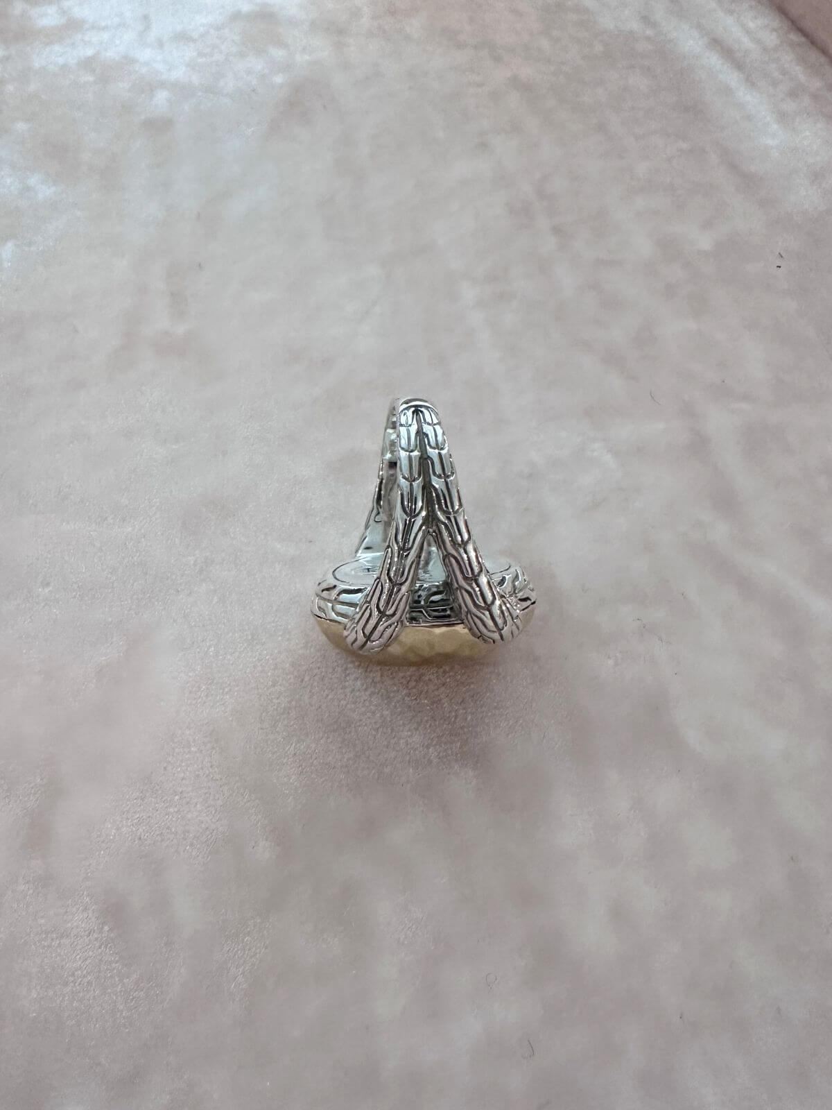 John Hardy ring silver and gold on red fixture showing side detail