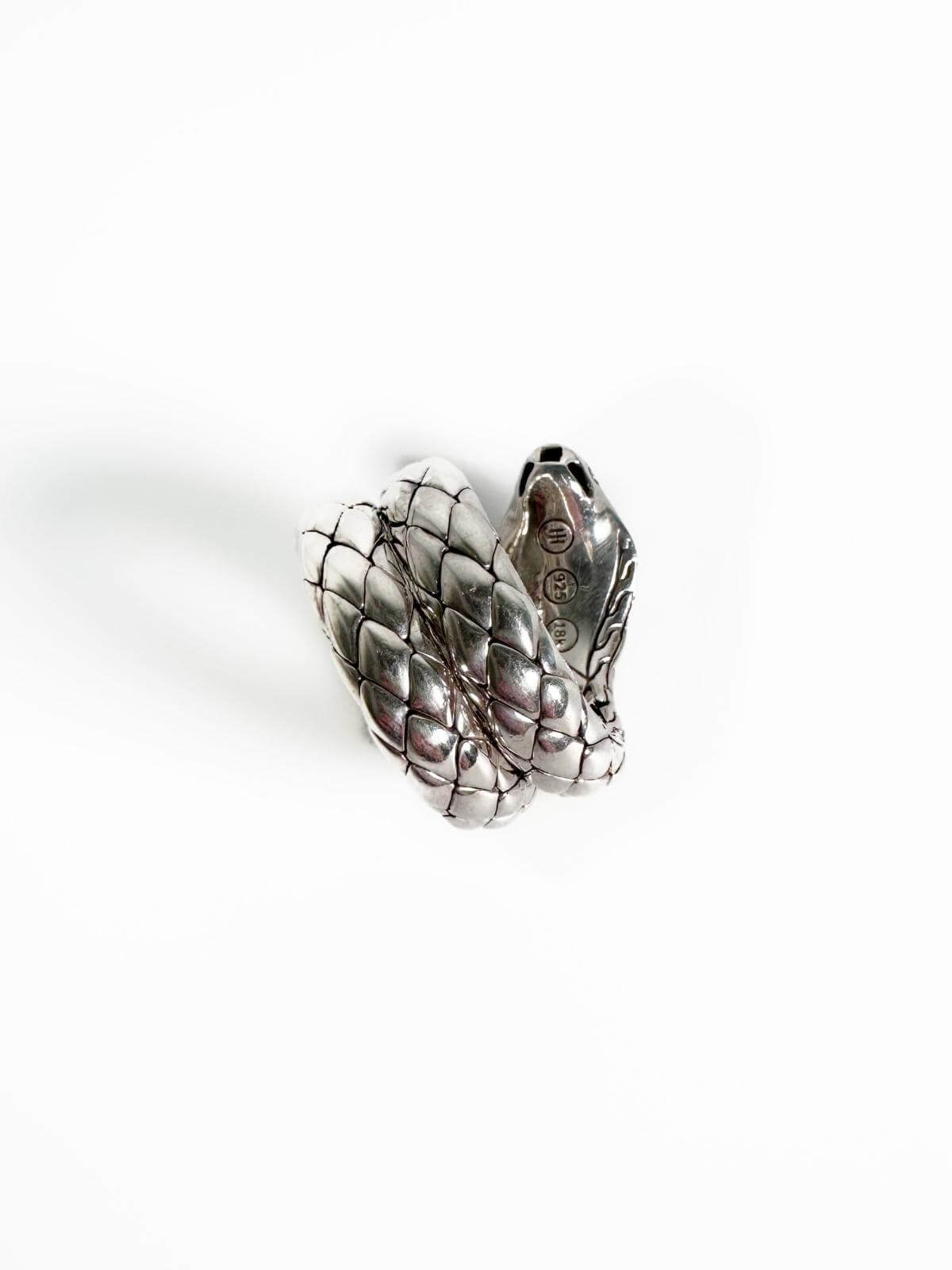 John Hardy Silver ring with a snake design on a white stand against a white background back view with stamp 