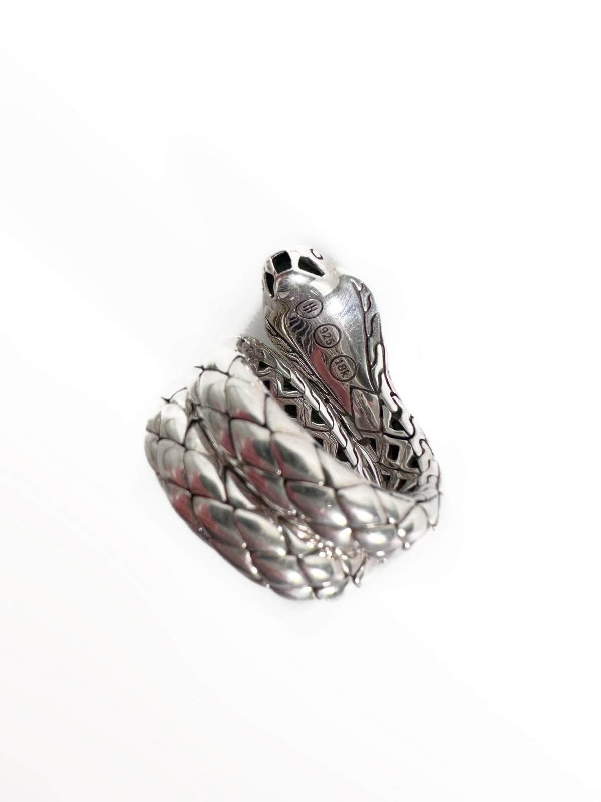 John Hardy Silver ring with a snake design on a white stand against a white background back view with stamp of JH and silver marking