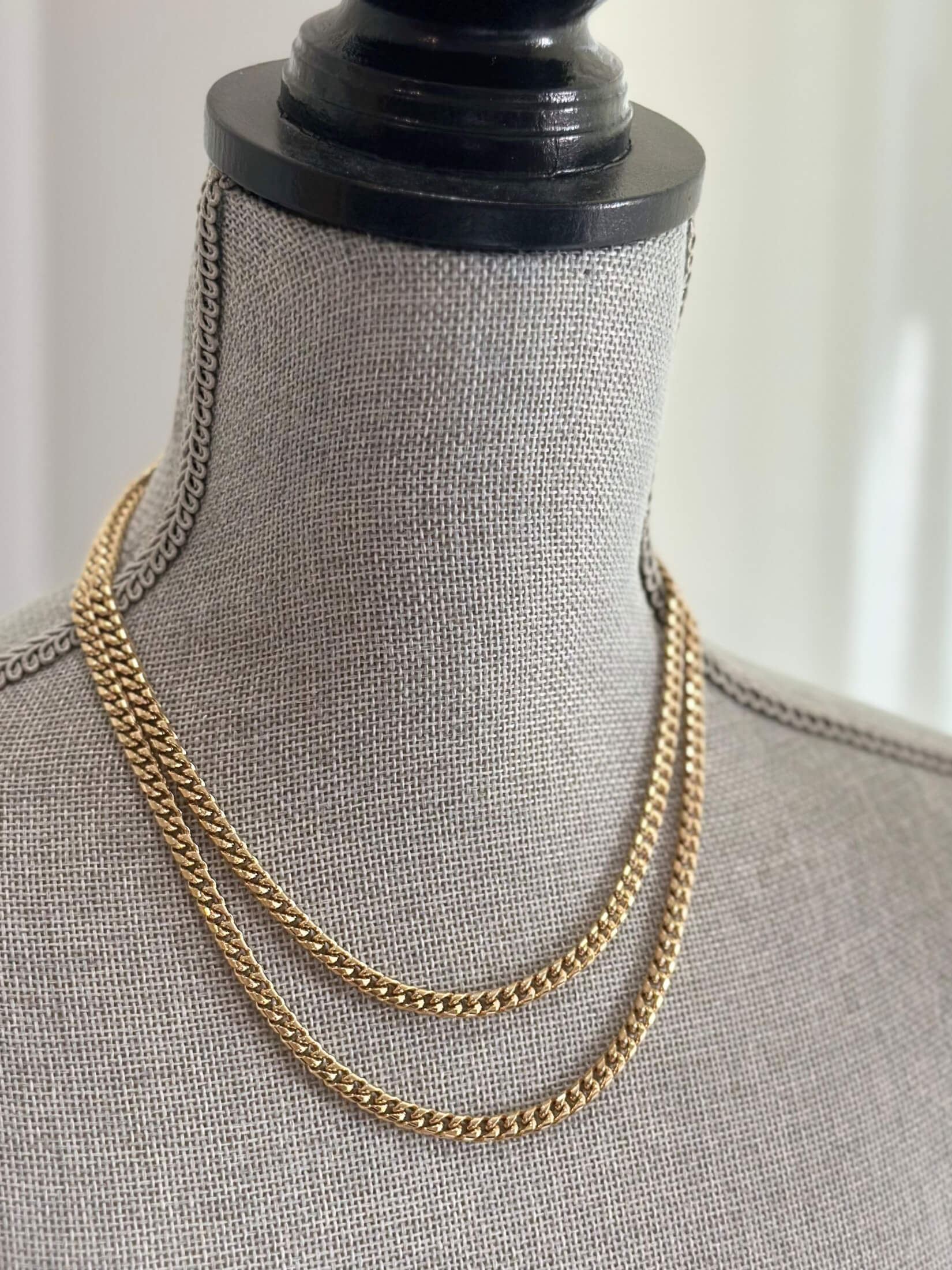 Louise Row featuring Jennifer Fisher curb chain gold necklace 2 row on grey mannequin