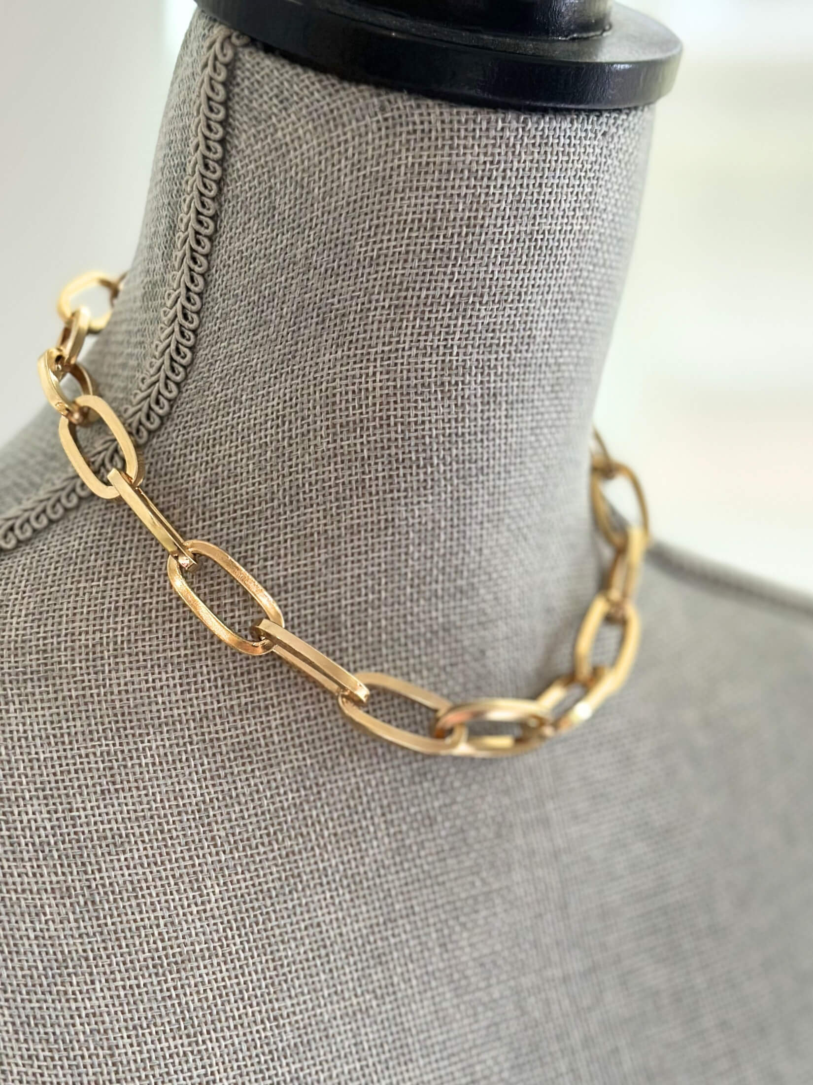 Louise Row featuring Jennifer Fisher gold link Dean Chain on grey mannequin