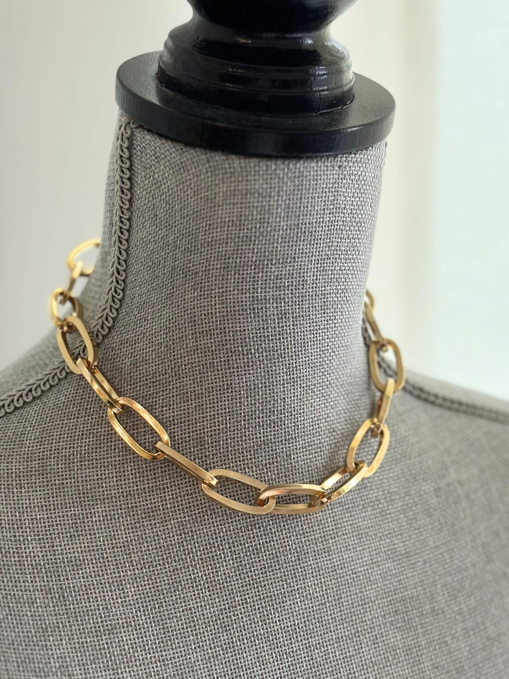 Louise Row featuring Jennifer Fisher gold link Dean Chain on grey mannequin