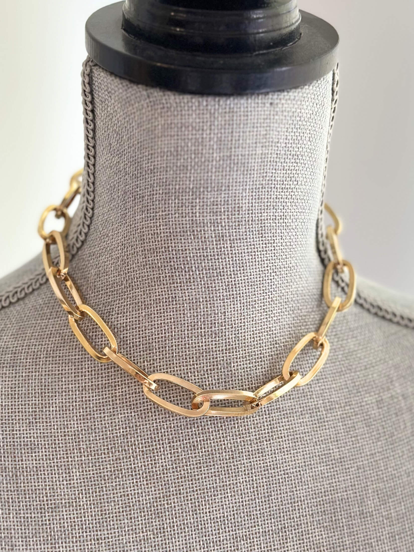 Louise Row featuring Jennifer Fisher gold link Dean Chain on grey mannequin