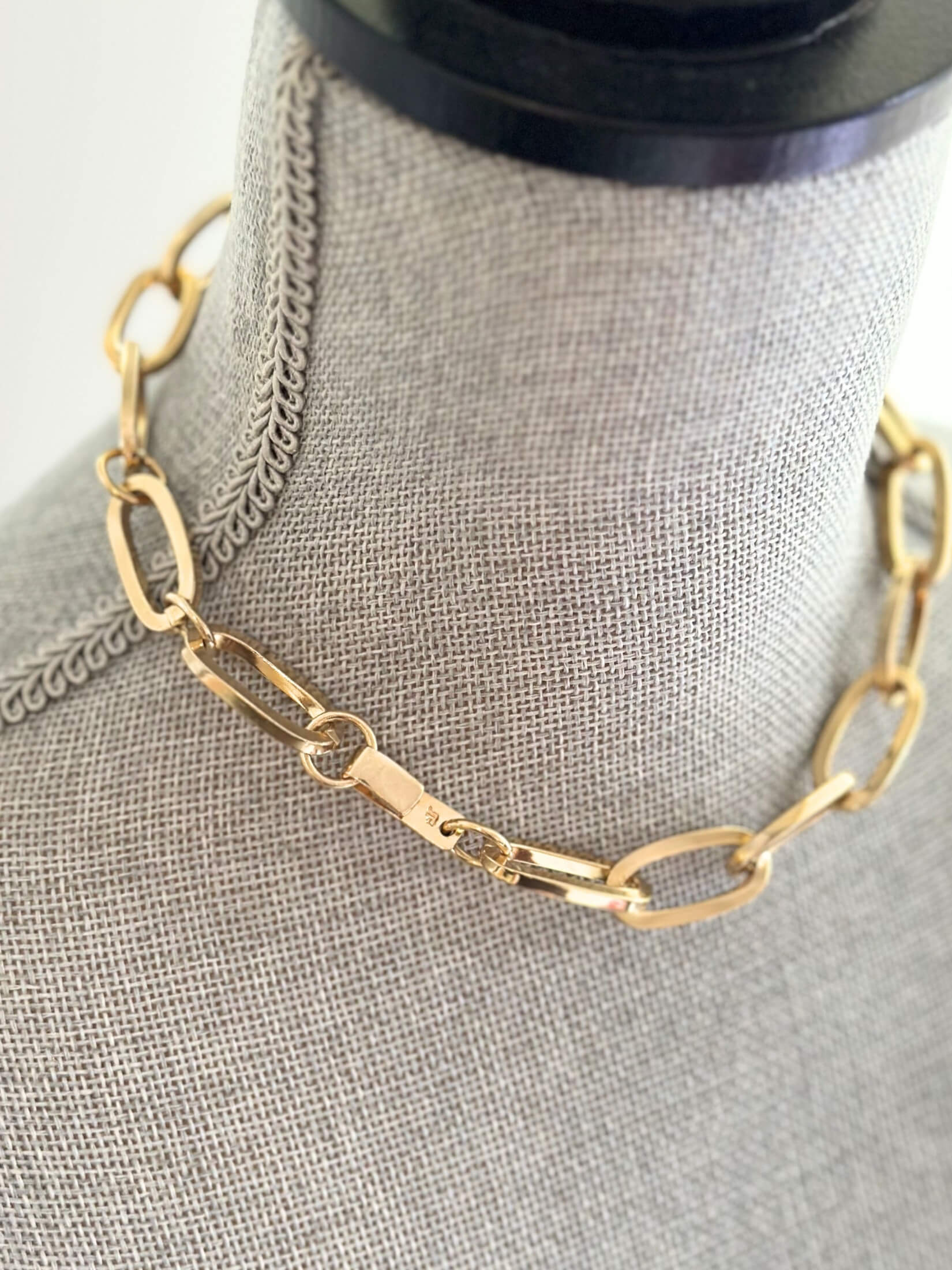 Louise Row featuring Jennifer Fisher gold link Dean Chain on grey mannequin