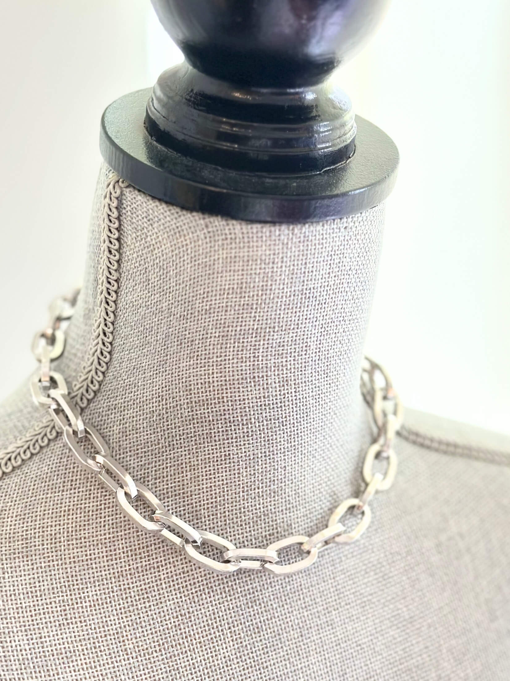 Louise Row featuring Jennifer Fisher silver large link chain necklace on grey mannequin
