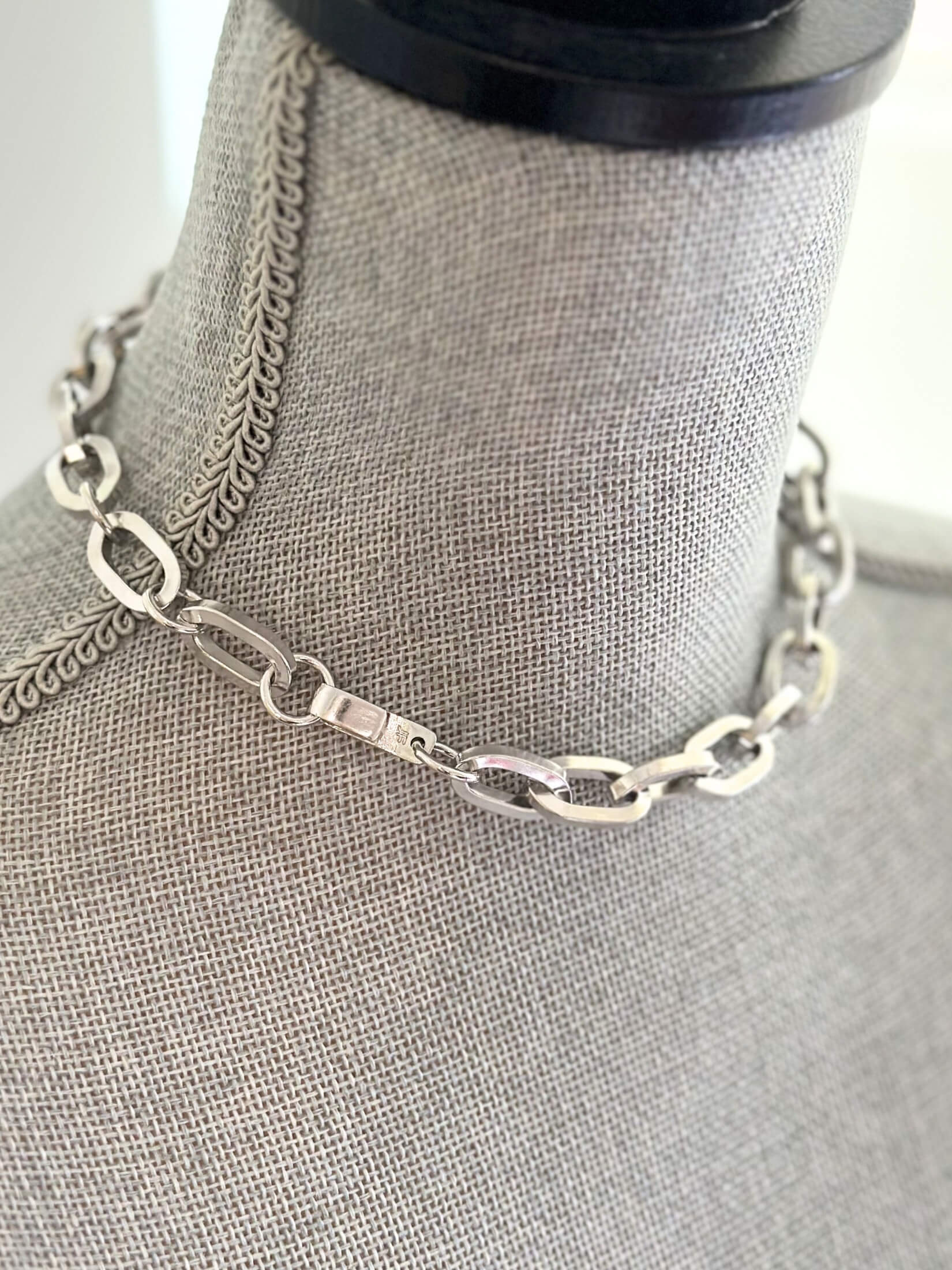 Louise Row featuring Jennifer Fisher silver large link chain necklace on grey mannequin
