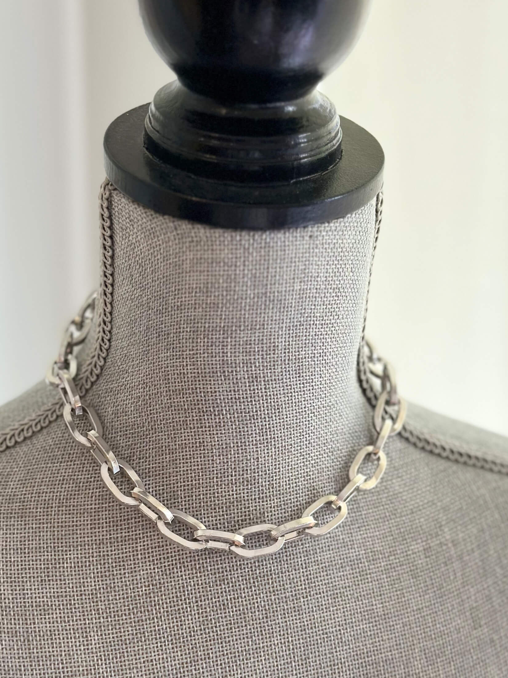Louise Row featuring Jennifer Fisher silver large link chain necklace on grey mannequin