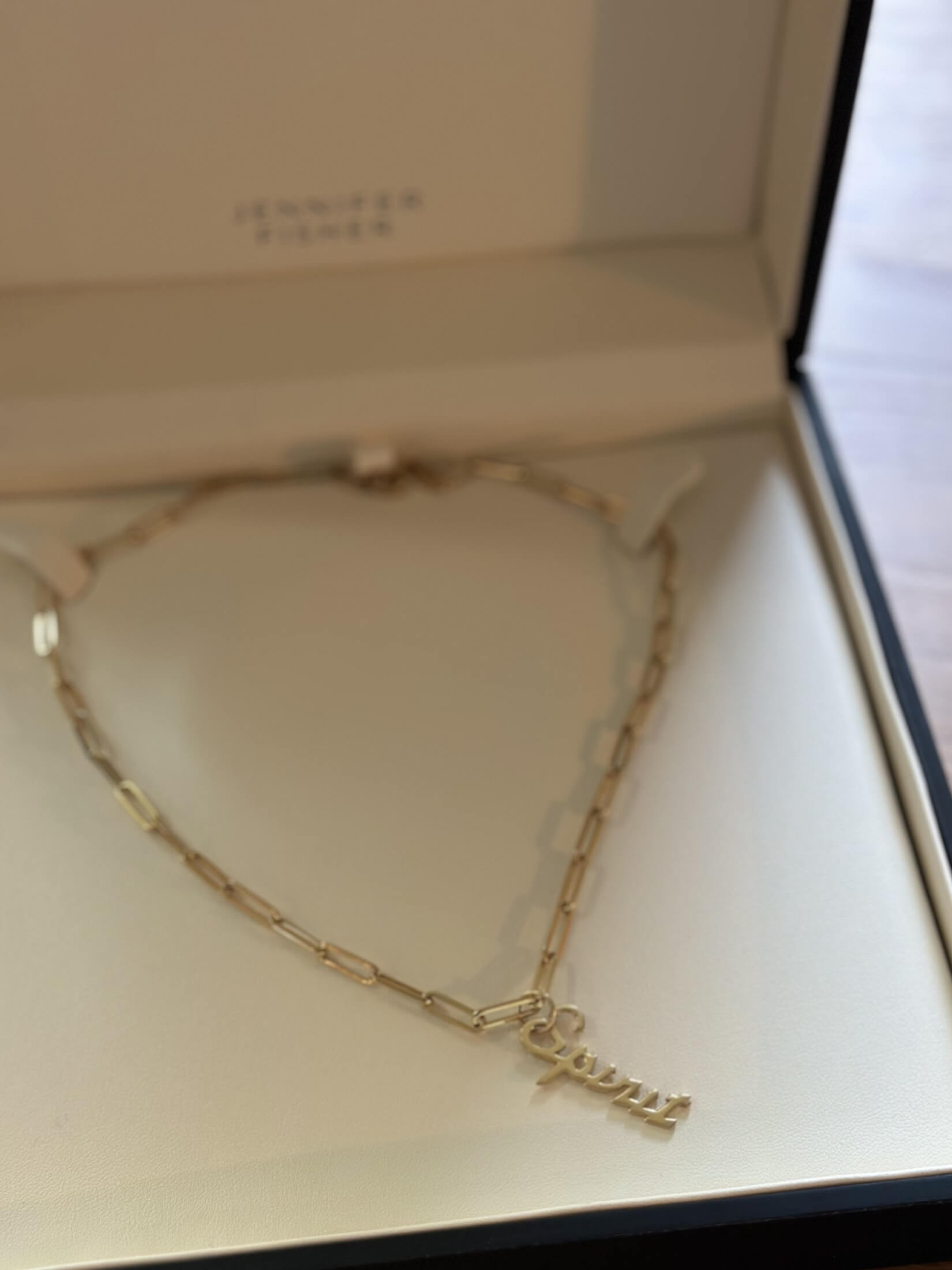 Louise Row featuring gold spirit Jennifer Fisher Charm in box