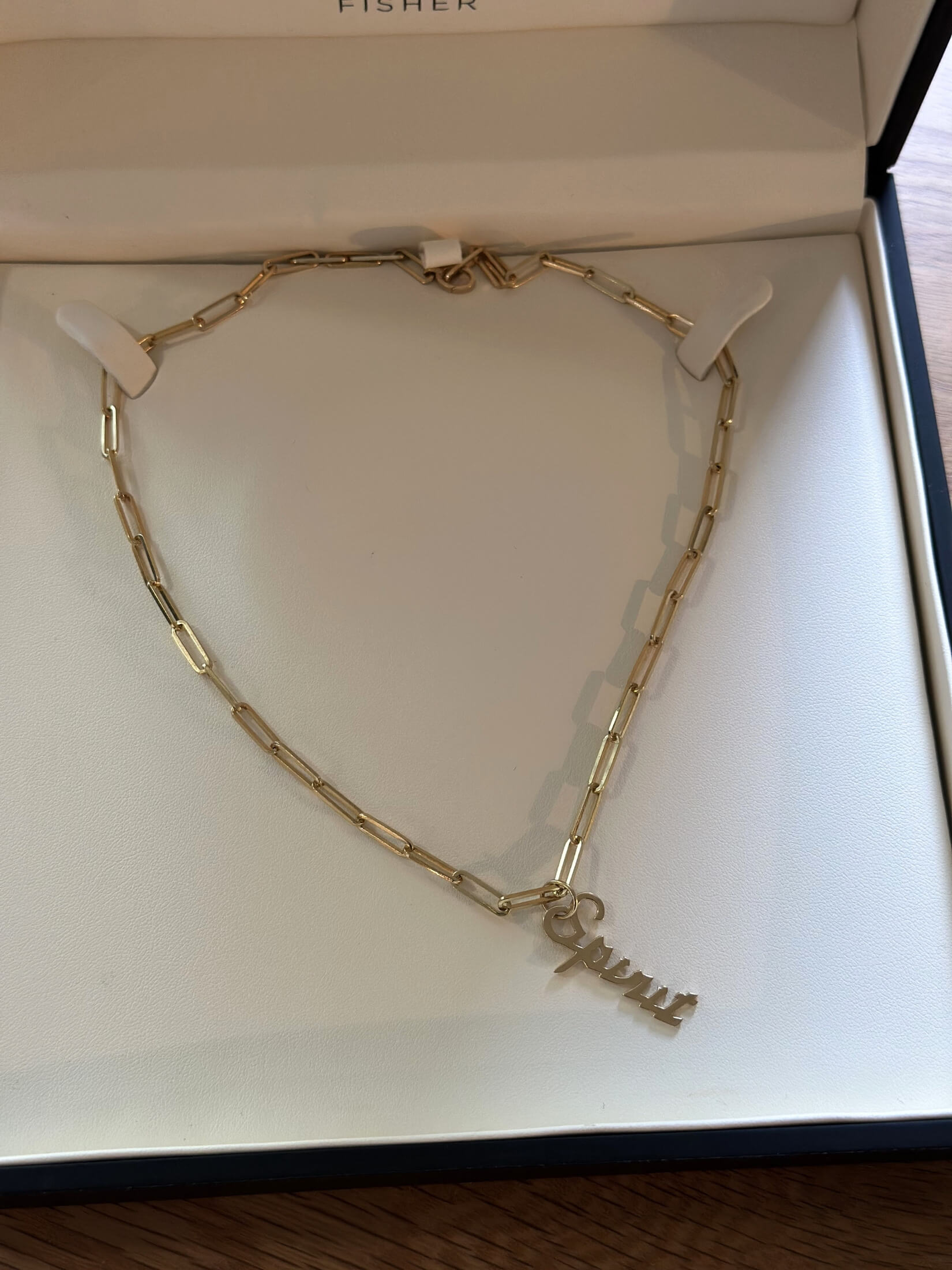 Louise Row featuring gold spirit Jennifer Fisher Charm in box