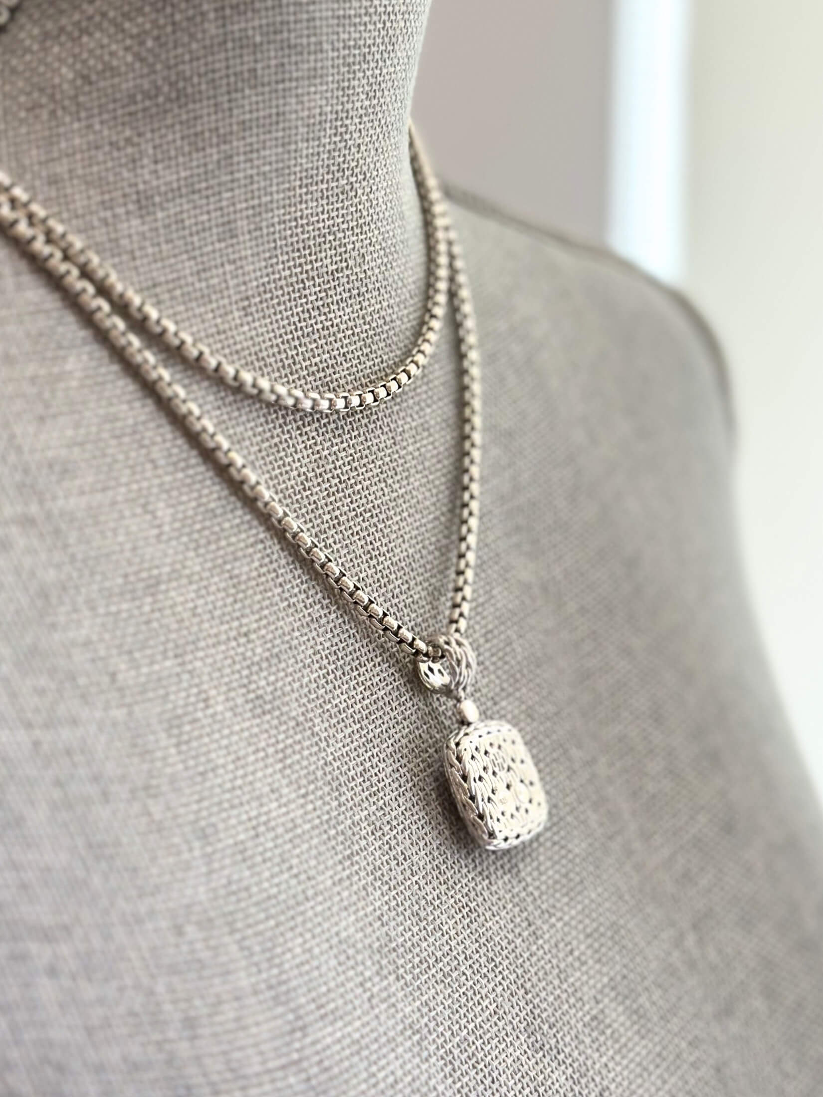 Louise Row featuring John Hardy Diamond Pendant in silver on grey mannequin