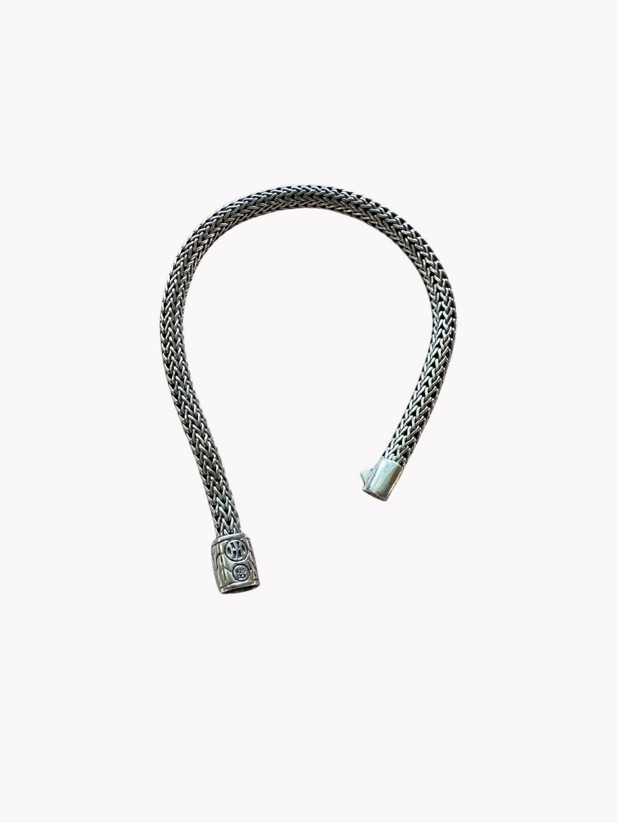 Louise Row resale shows John Hardy Silver bracelet with black accents on a white background showing back side with signature