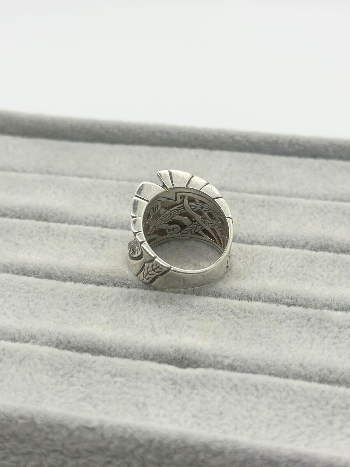 John Hardy silver and diamond ring on grey fixture. Back view