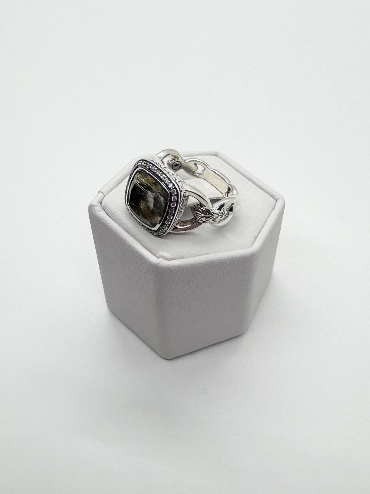 John Hardy quartz ring on white fixture and background.