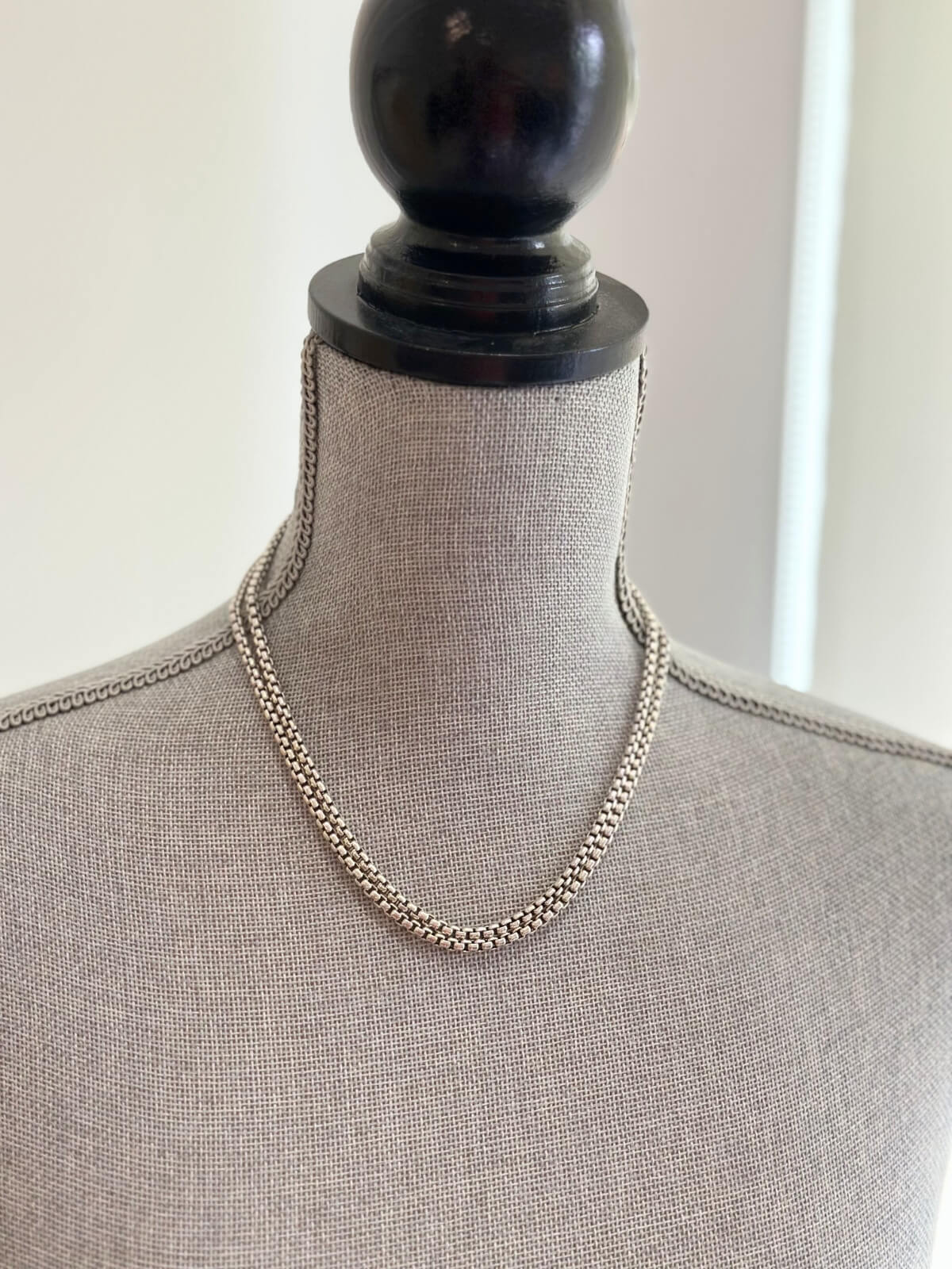 Louise Row featuring John Hardy Classic box chain on grey mannequin